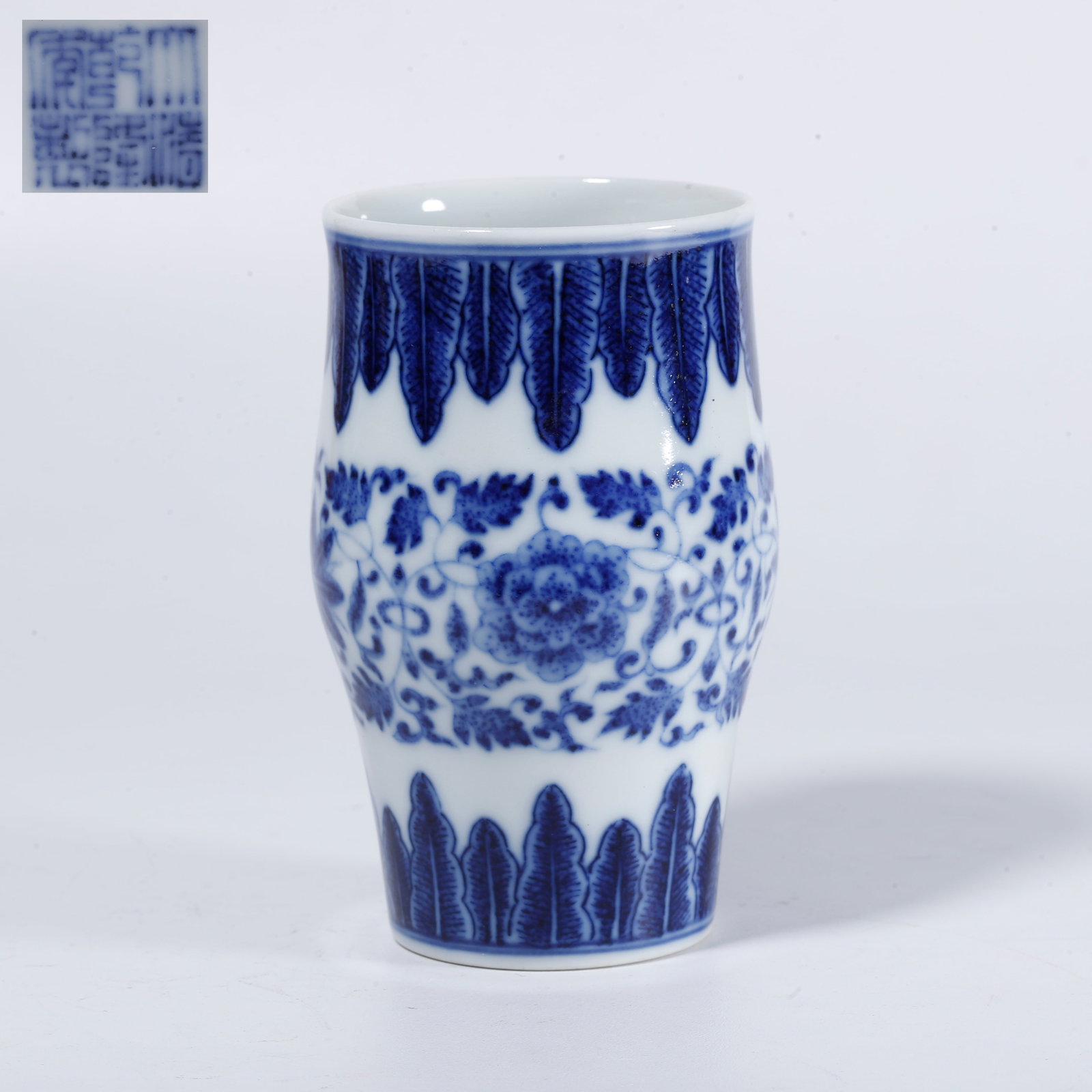 A BLUE-AND-WHITE SCROLLING FLORAL VASE INSERT (1 of 10)