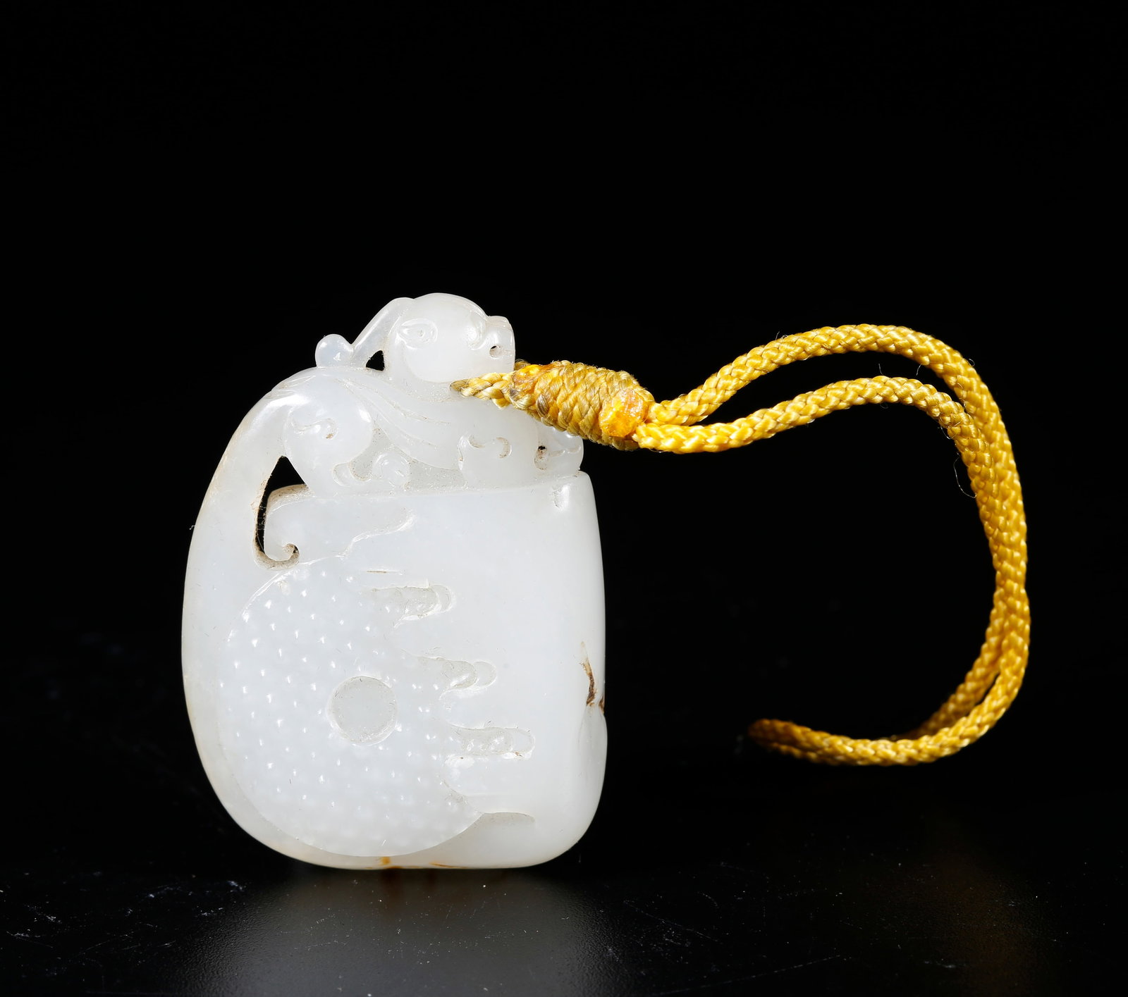 A HETIAN JADE CARVED BEAST-PATTERN PENDANT (1 of 9)
