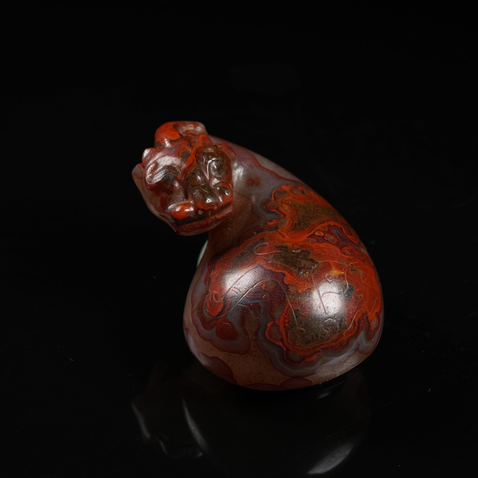 A WARRING STATES RED AGATE AUSPICIOUS BEAST BELT BUCKLE (1 of 11)