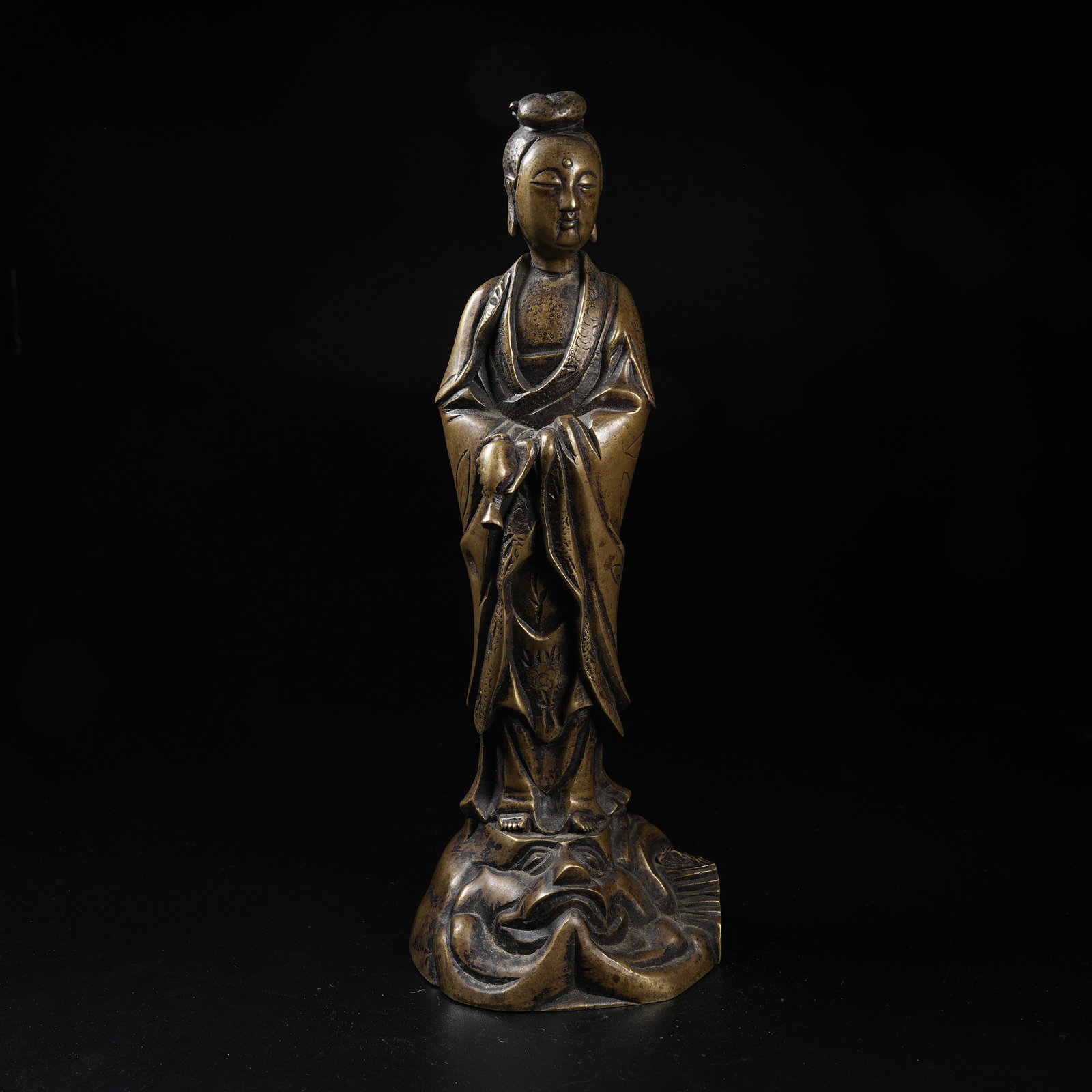 A STANDING BRONZE STATUE OF VASE-HELD GUANYIN: Standing Bronze Statue of Vase-held Guanyin