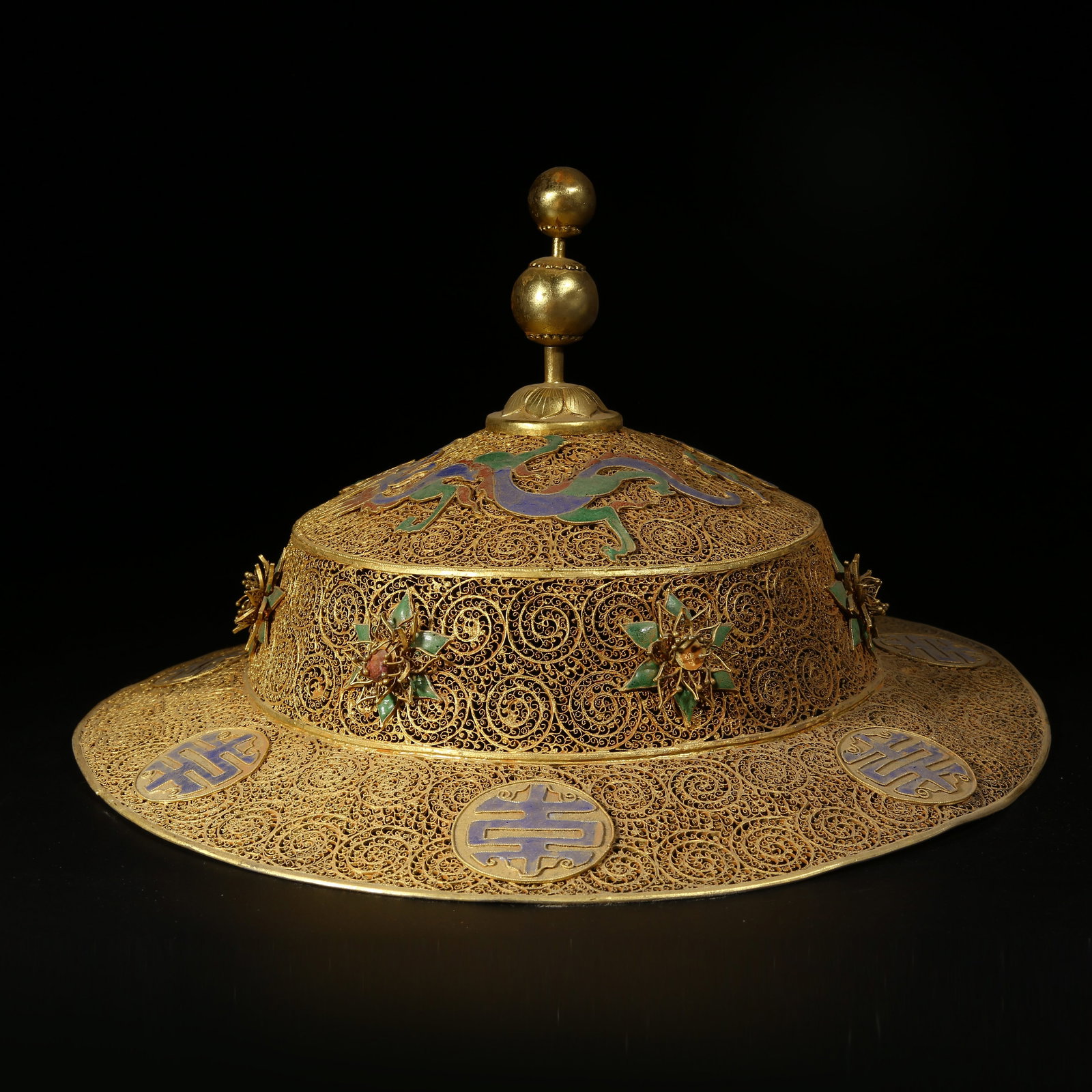 A GILDED SILVER FILIGREE CLOISONNÉ HAT WITH DRAGON MOTIFS: Gilded silver filigree cloisonné hat with dragon motifs
