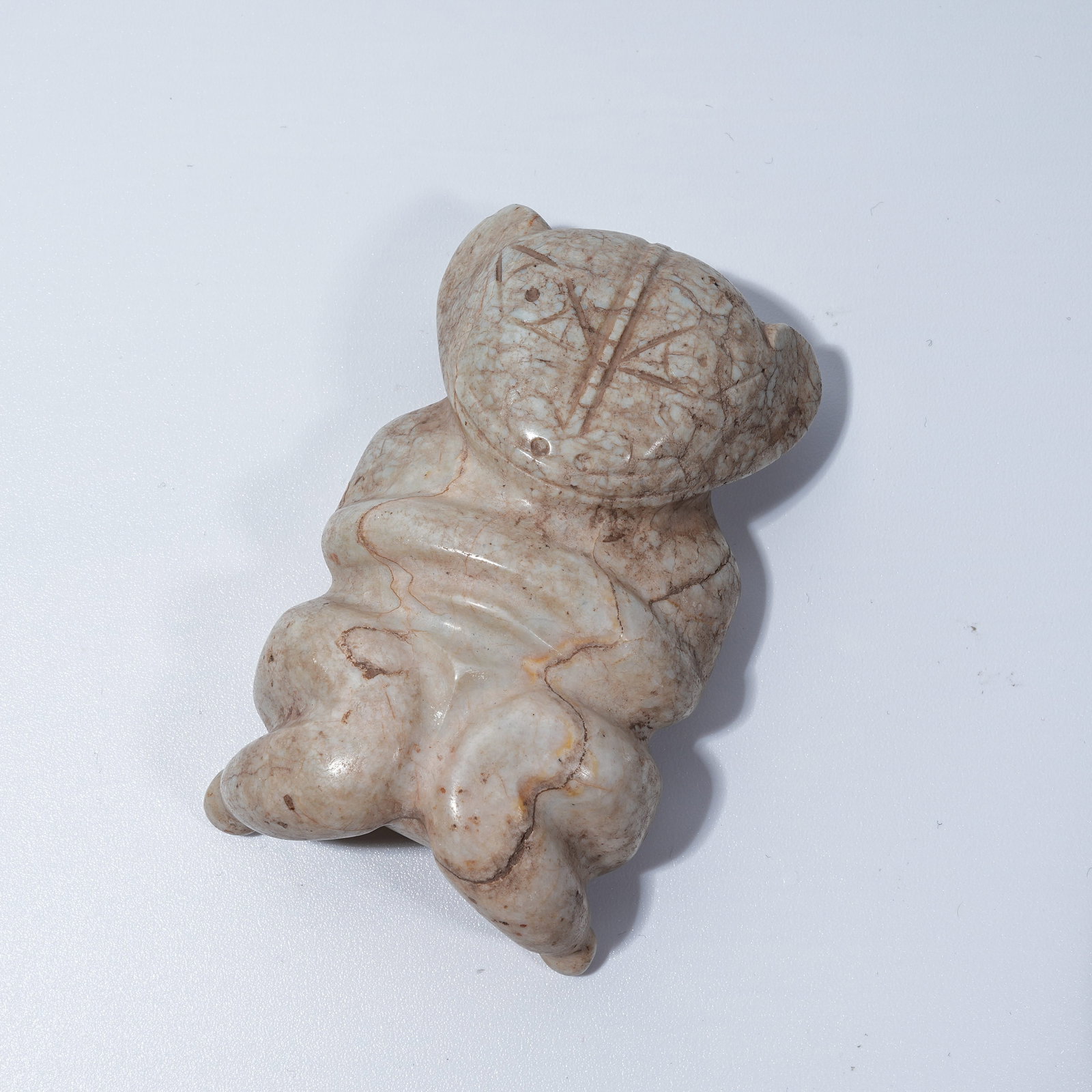A HONGSHAN CULTURE ARCHAIC JADE ANTHROPOMORPHIC DEITY PENDANT: Hongshan Culture archaic jade anthropomorphic deity pendant