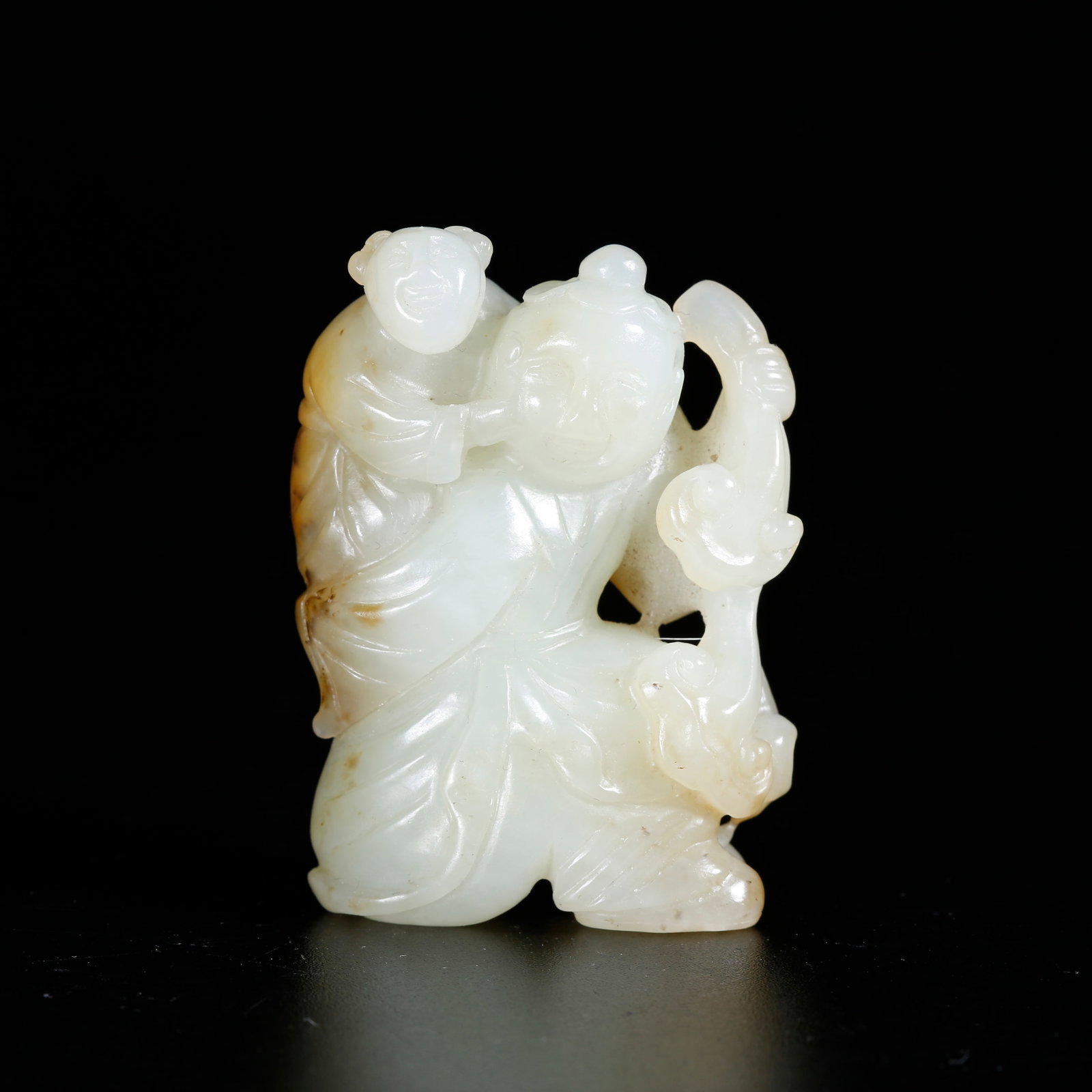 A HETIAN JADE BOY-SHAPED ORNAMENT: Hetian Jade Boy-shaped Ornament
