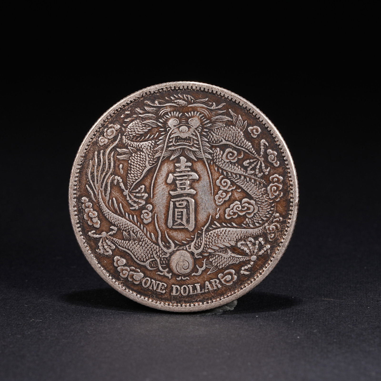 A SILVER DOLLAR COIN - 3