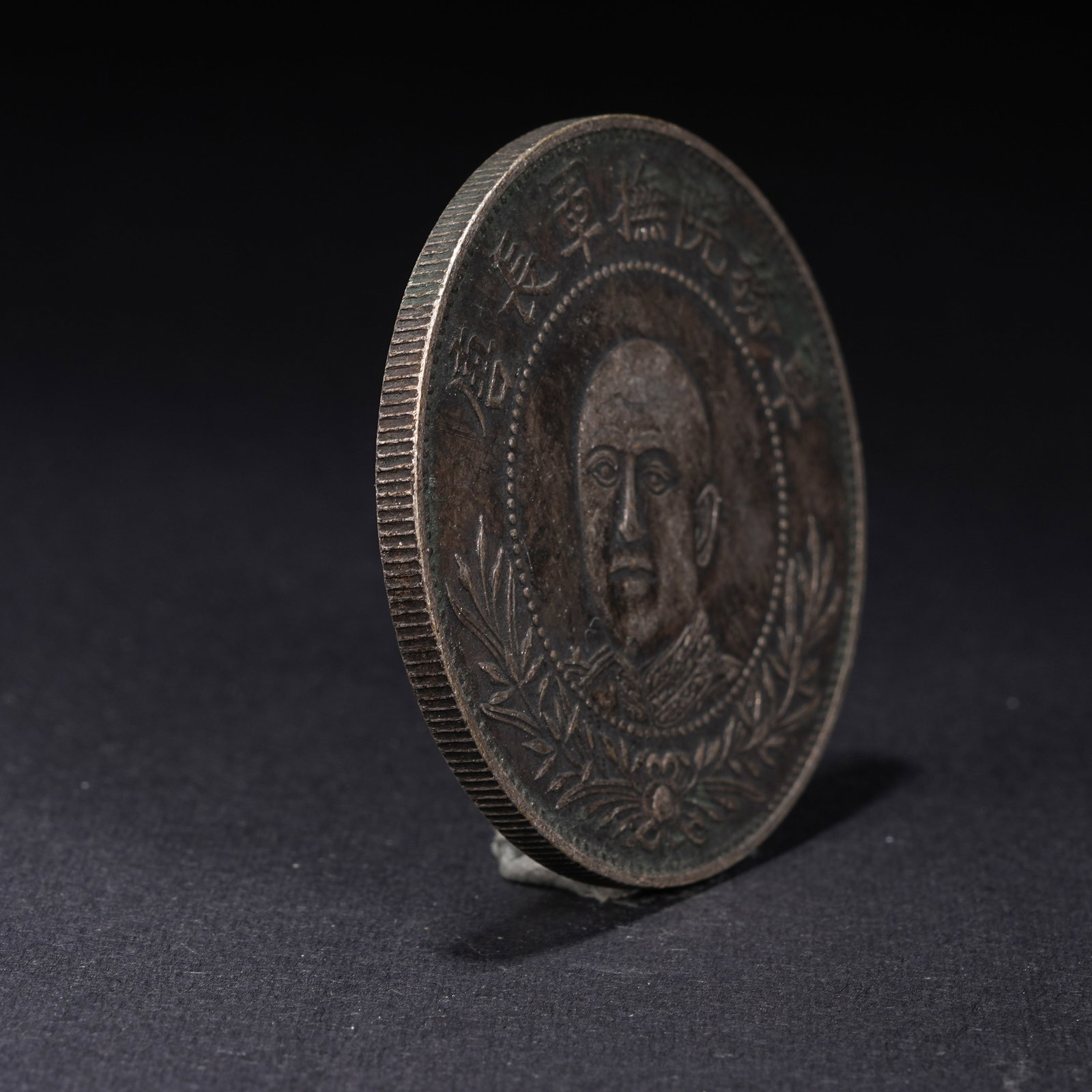 A SILVER DOLLAR COIN - 2