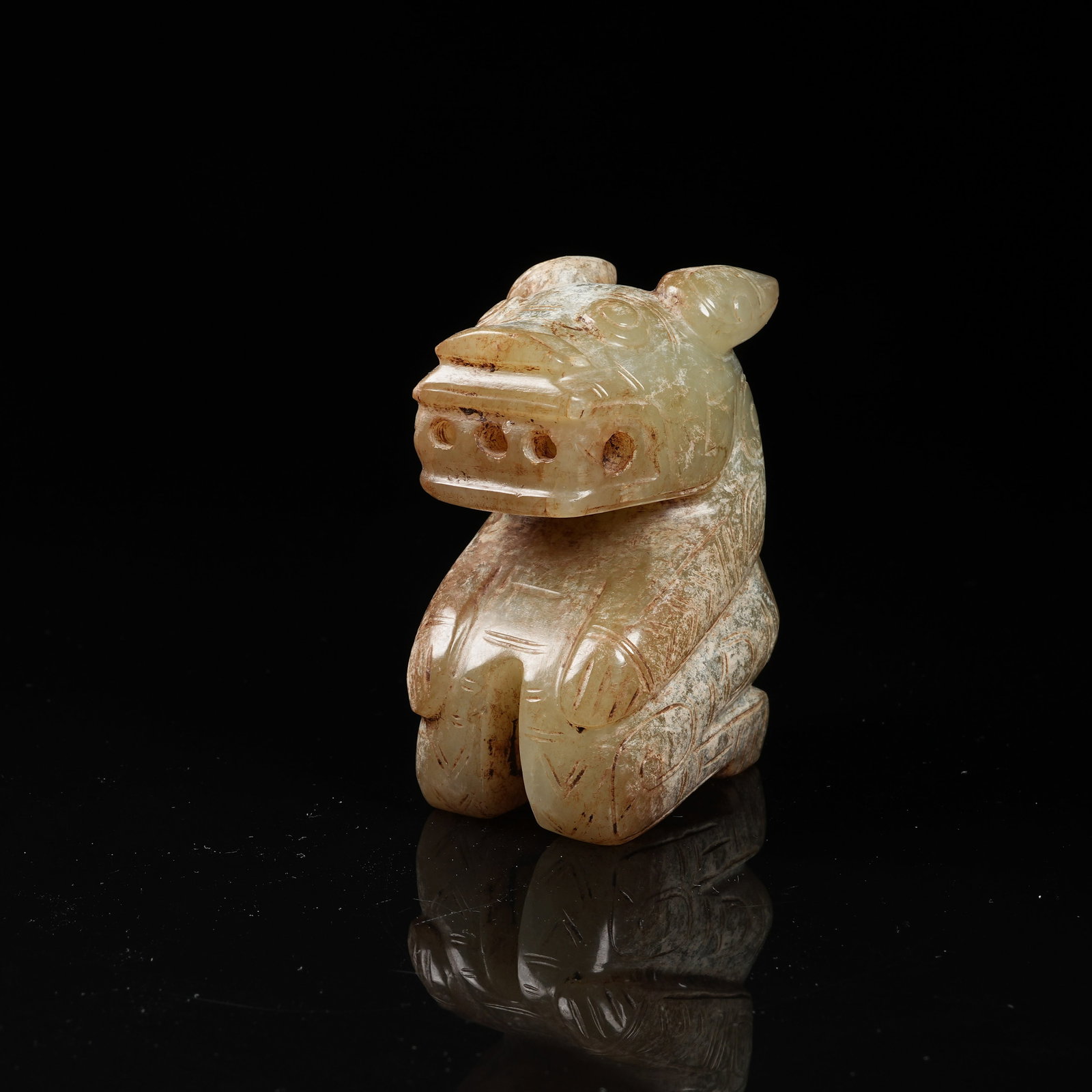 A ARCHAIC JADE KNEELING FIGURE PENDANT: Archaic jade kneeling figure pendant