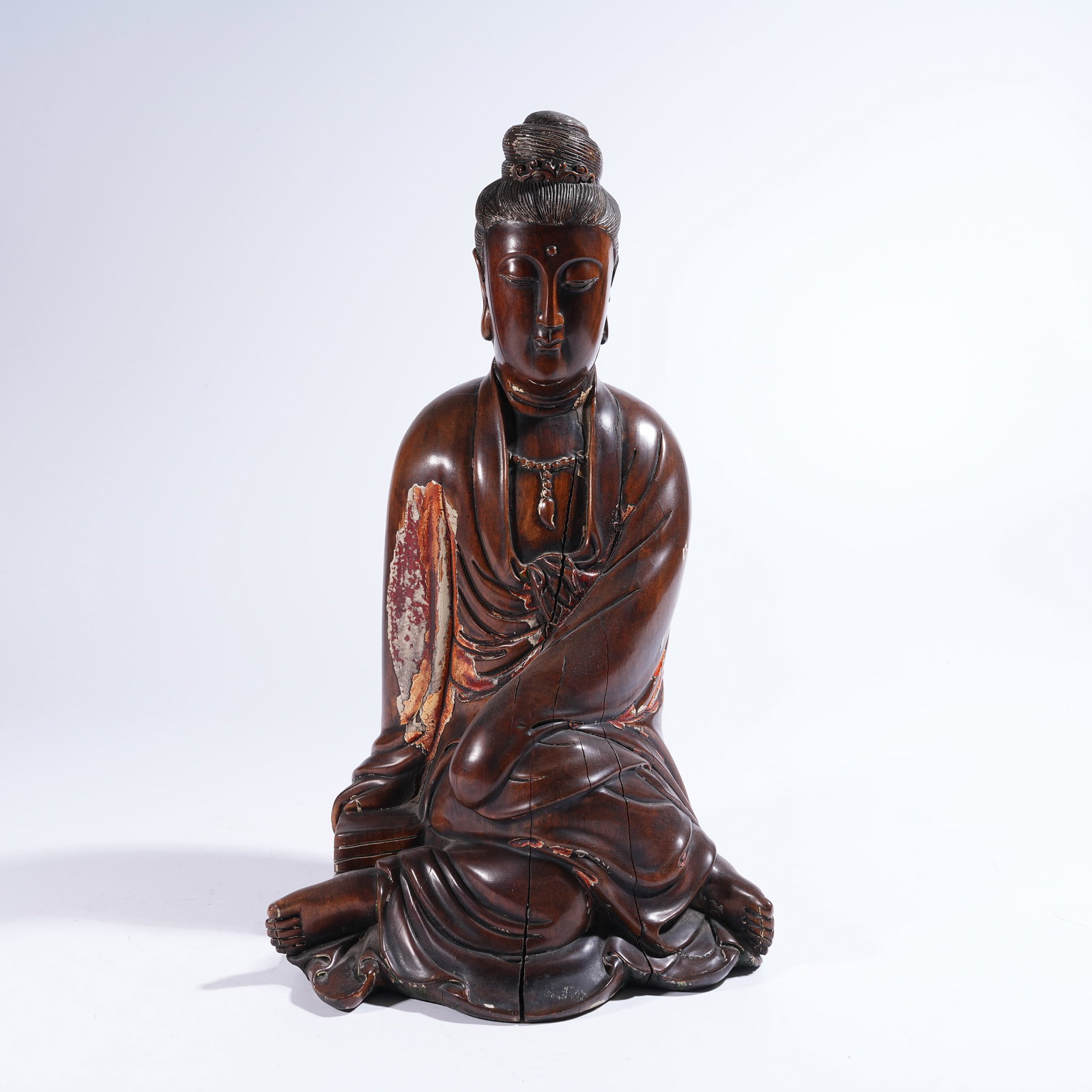 A HUANGHUALI PAINTED SEATED GUANYIN FIGURE: Huanghuali Painted Seated Guanyin Figure