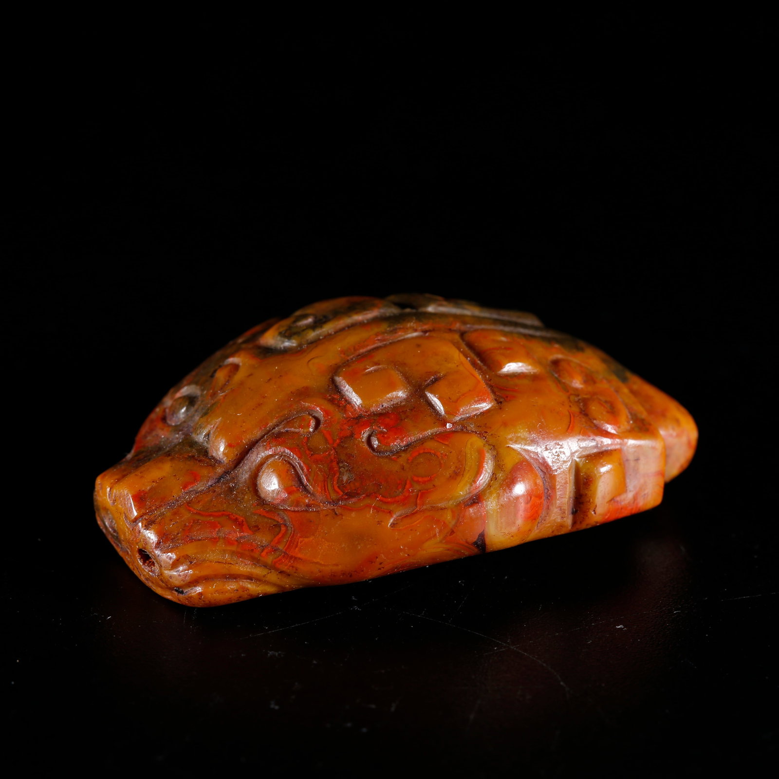 A SOUTHERN RED AGATE CARVED BEAST-SHAPED PENDANT (1 of 9)