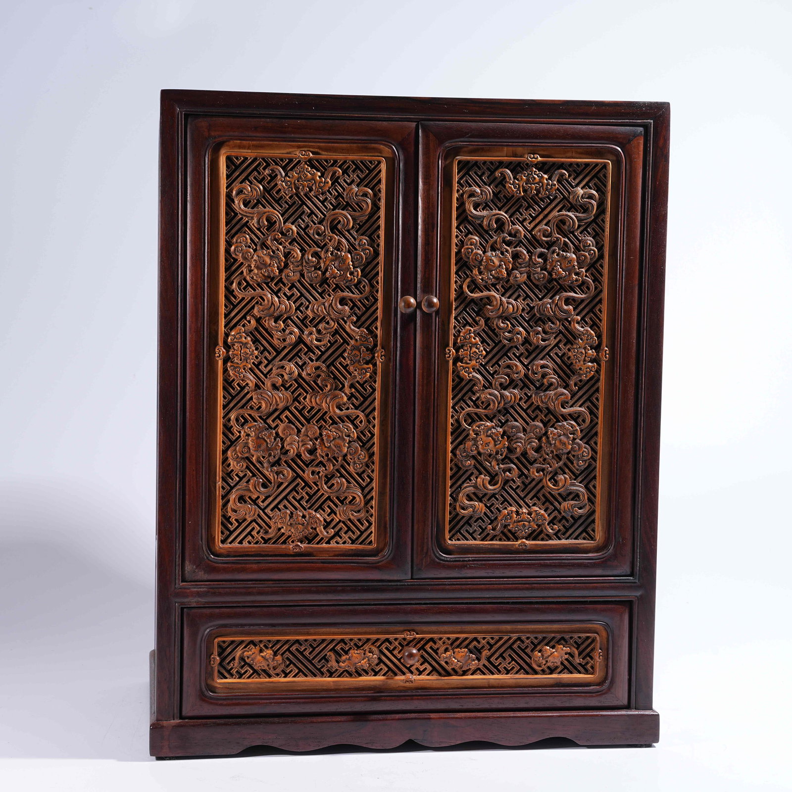A HONGMU CABINET INLAID WITH HUANGHUALI AND "TEN THOUSAND BLESSINGS" MOTIFS (1 of 9)