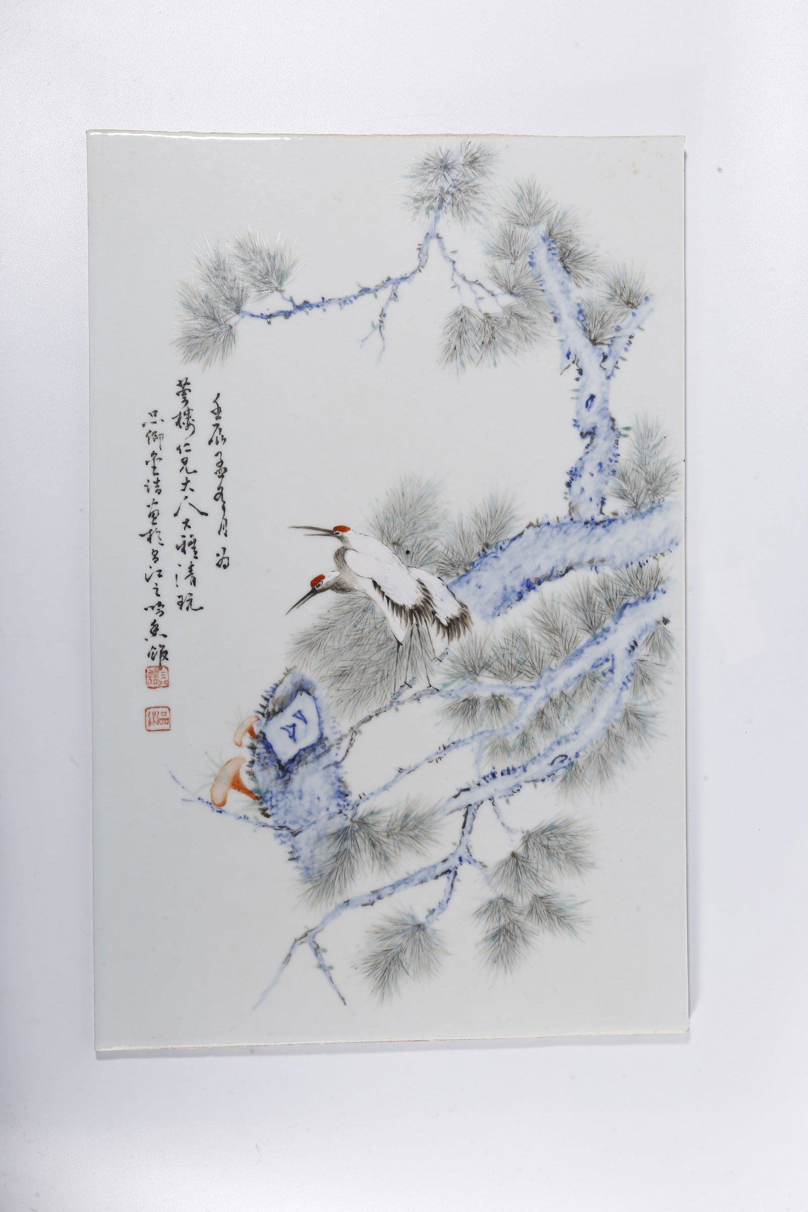 A FAMILLE ROSE PORCELAIN PANEL WITH PINE AND CRANE PATTERN: Famille Rose Porcelain Panel with Pine and Crane Pattern