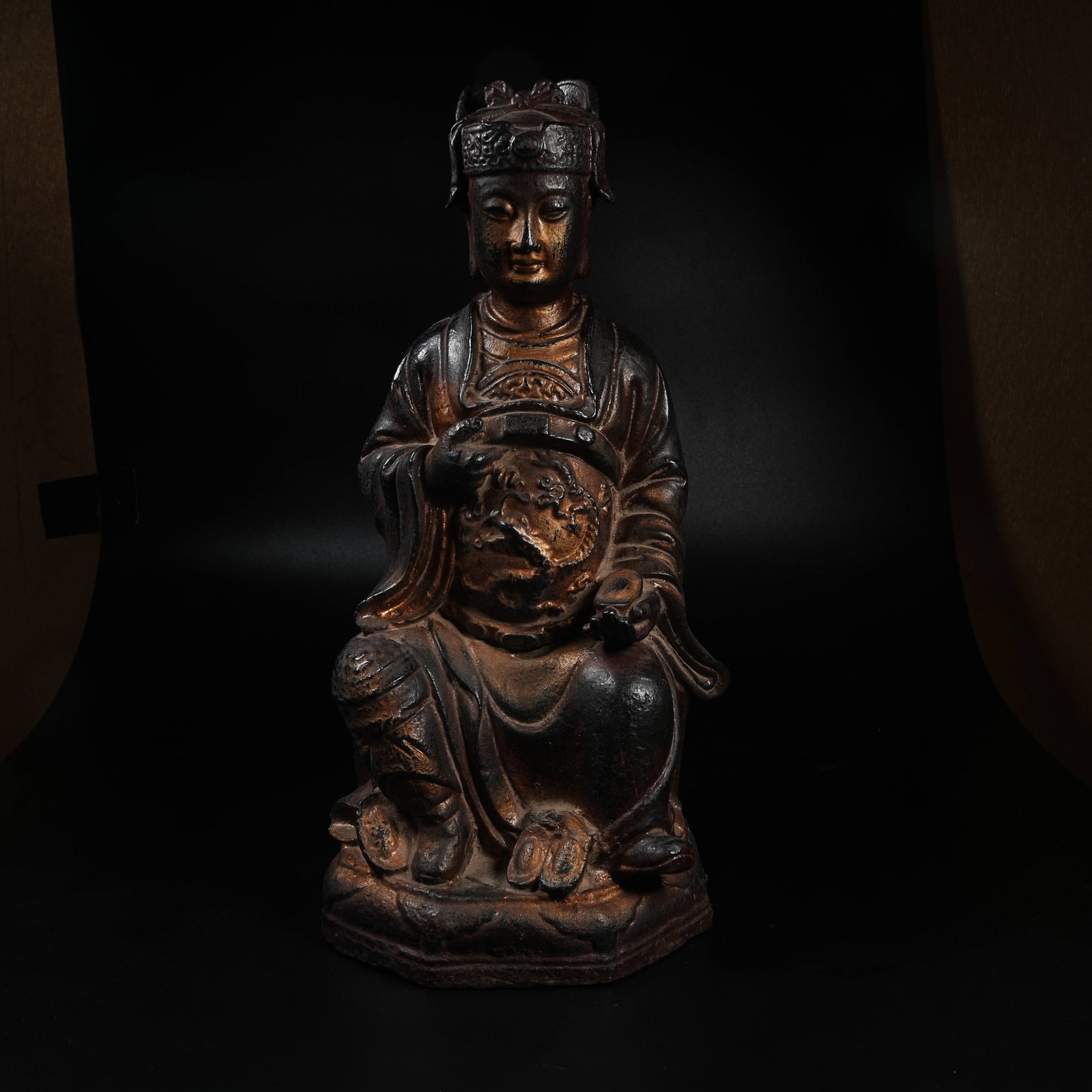 A CAST IRON SEATED STATUE OF GOD OF WEALTH: Cast Iron Seated Statue of God of Wealth