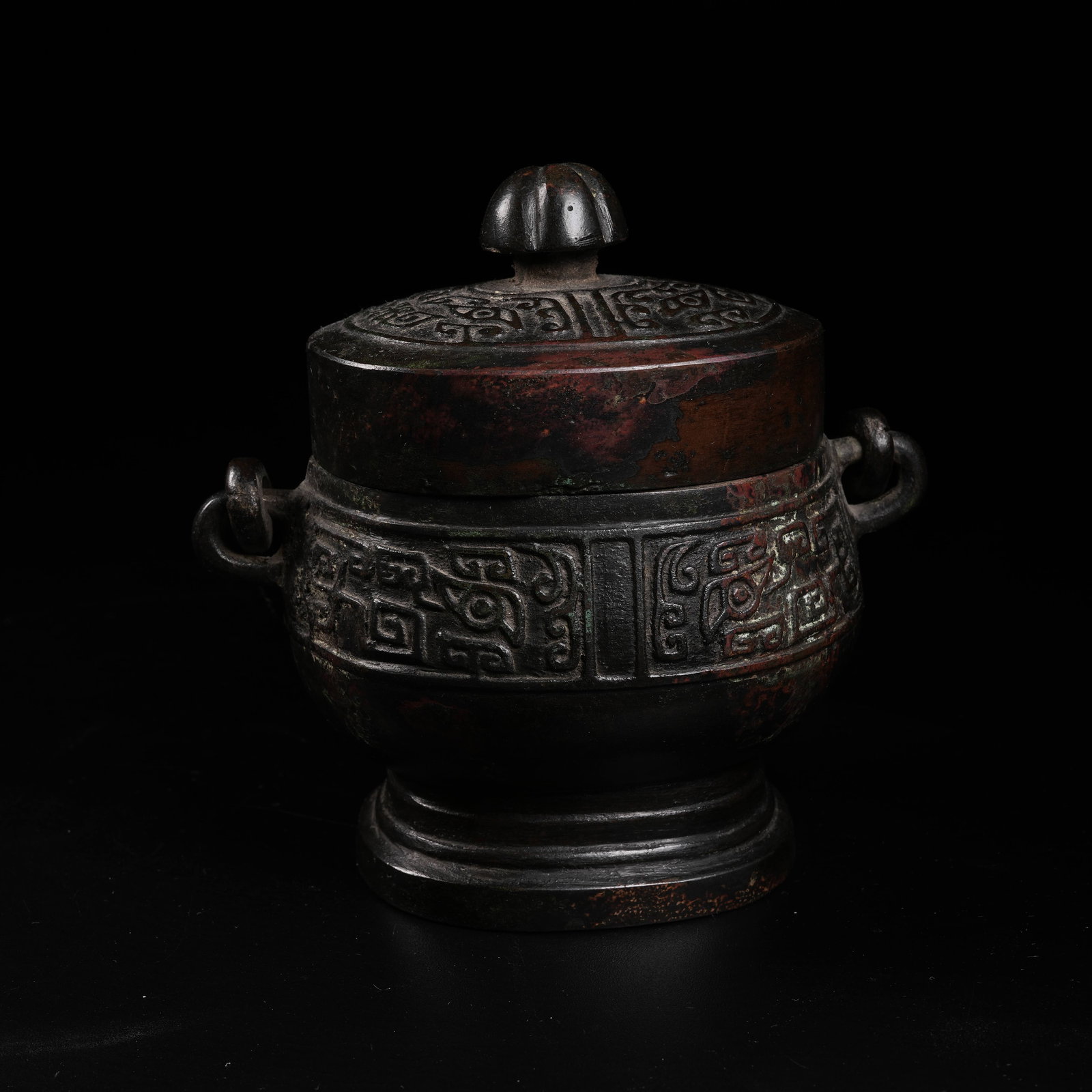 A COPPER LOOP-HANDLED YOU VESSEL WITH BEAST MASK PATTERN (1 of 9)