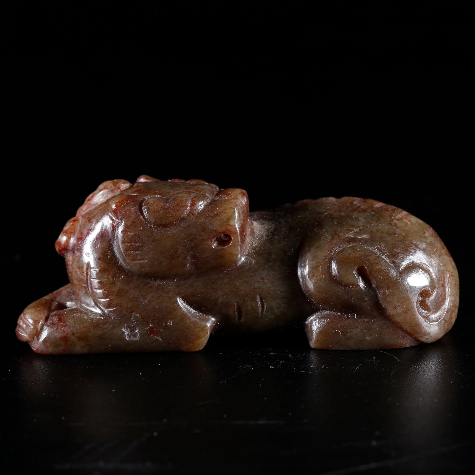 A HETIAN JADE HAND PIECE CARVED WITH BEAST PATTERNS: Hetian Jade Hand Piece Carved with Beast Patterns