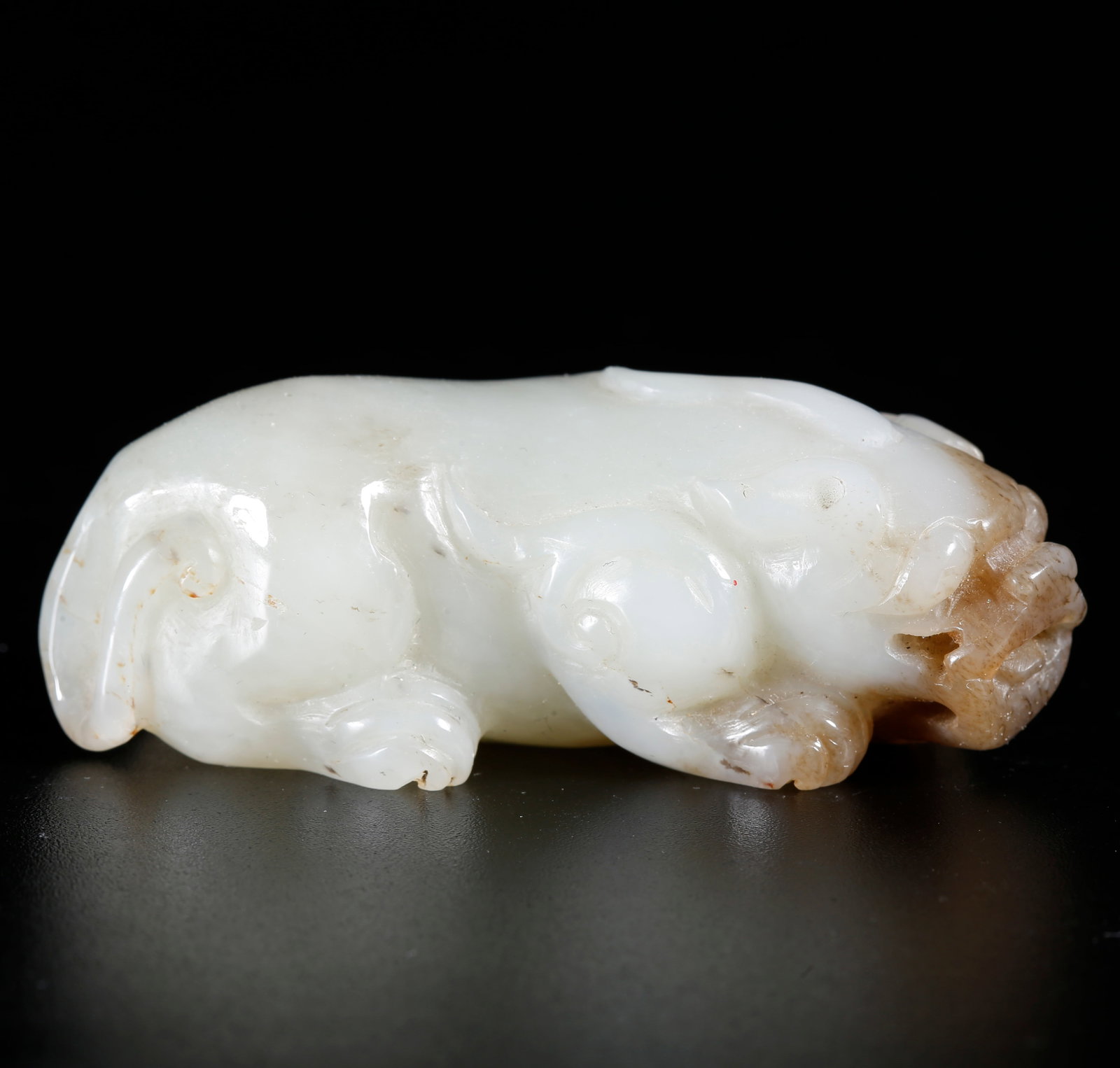 A HETIAN JADE BEAST-SHAPED HAND ORNAMENT: Hetian Jade Beast-shaped Hand Ornament