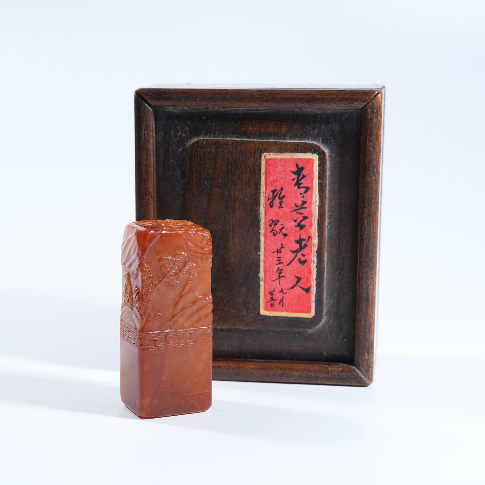 A SHOUSHAN TIANHUANG STONE SEAL WITH SCHOLAR UNDER PINE PATTERN: Shoushan Tianhuang Stone Seal with Scholar Under Pine Pattern