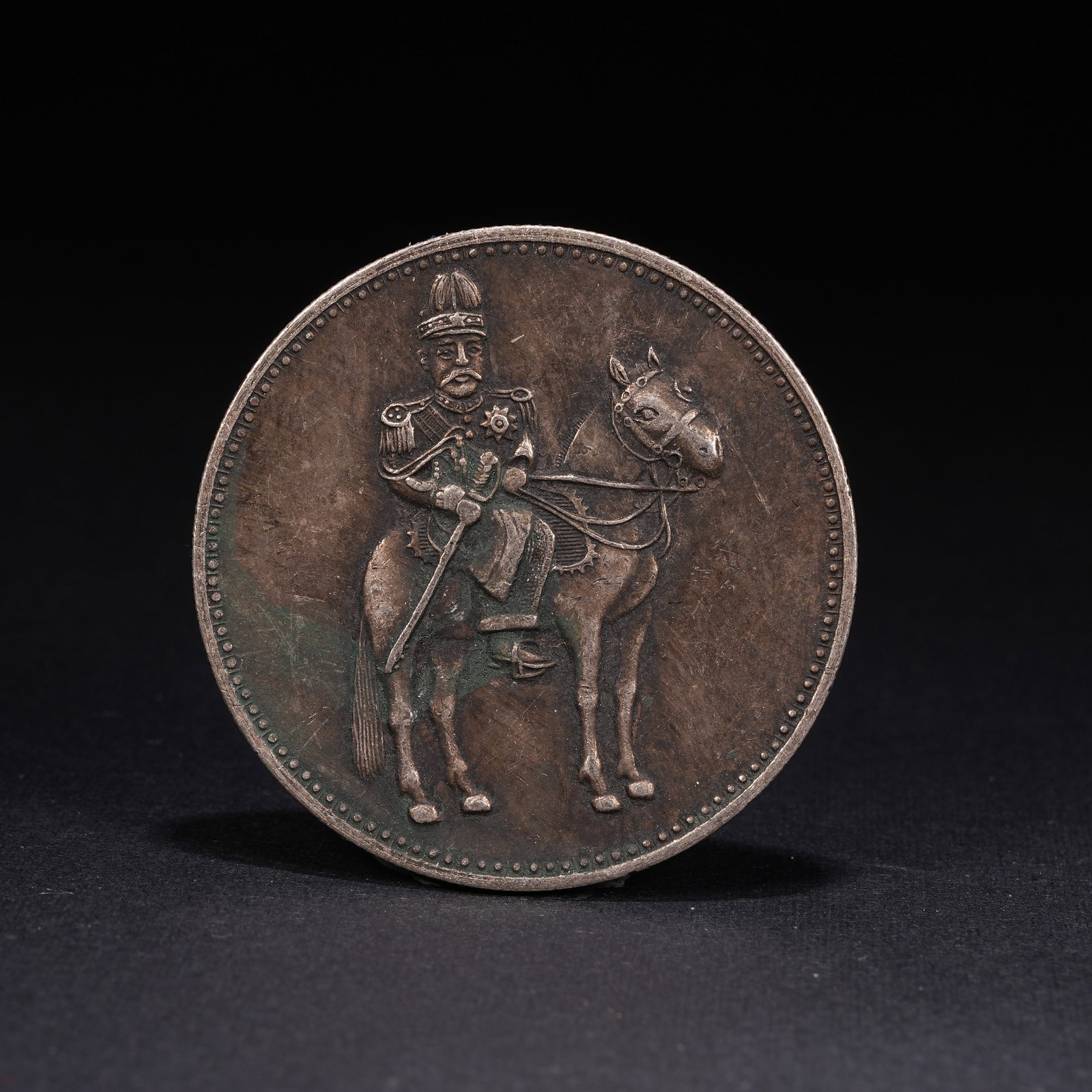 A SILVER DOLLAR COIN: One Silver dollar Coin