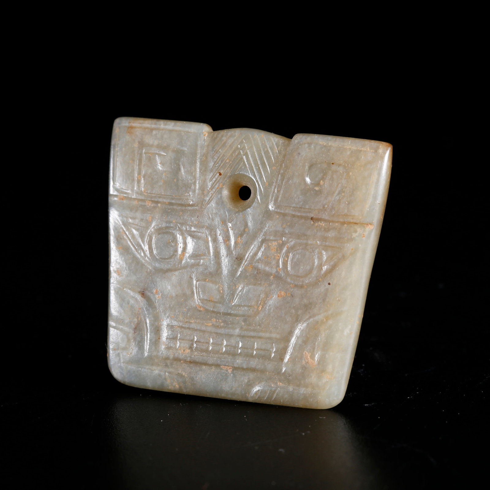 A HETIAN JADE PENDANT CARVED WITH BEAST FACE PATTERN: Hetian Jade Pendant Carved with Beast Face Pattern