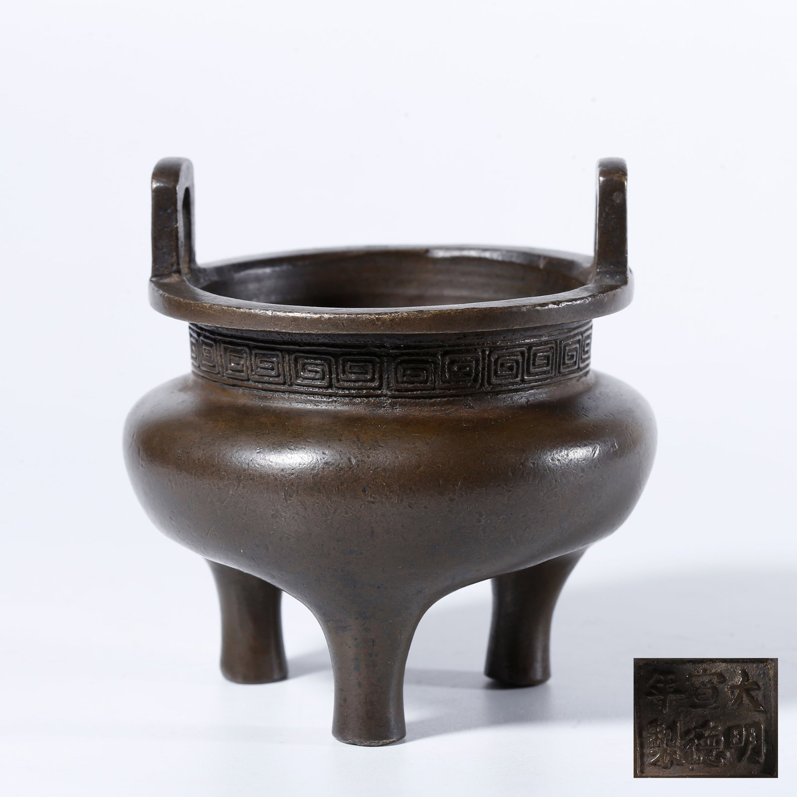 A COPPER THREE-LEGGED INCENSE BURNER WITH UPRIGHT EARS: Copper Three-legged Incense Burner with Upright Ears