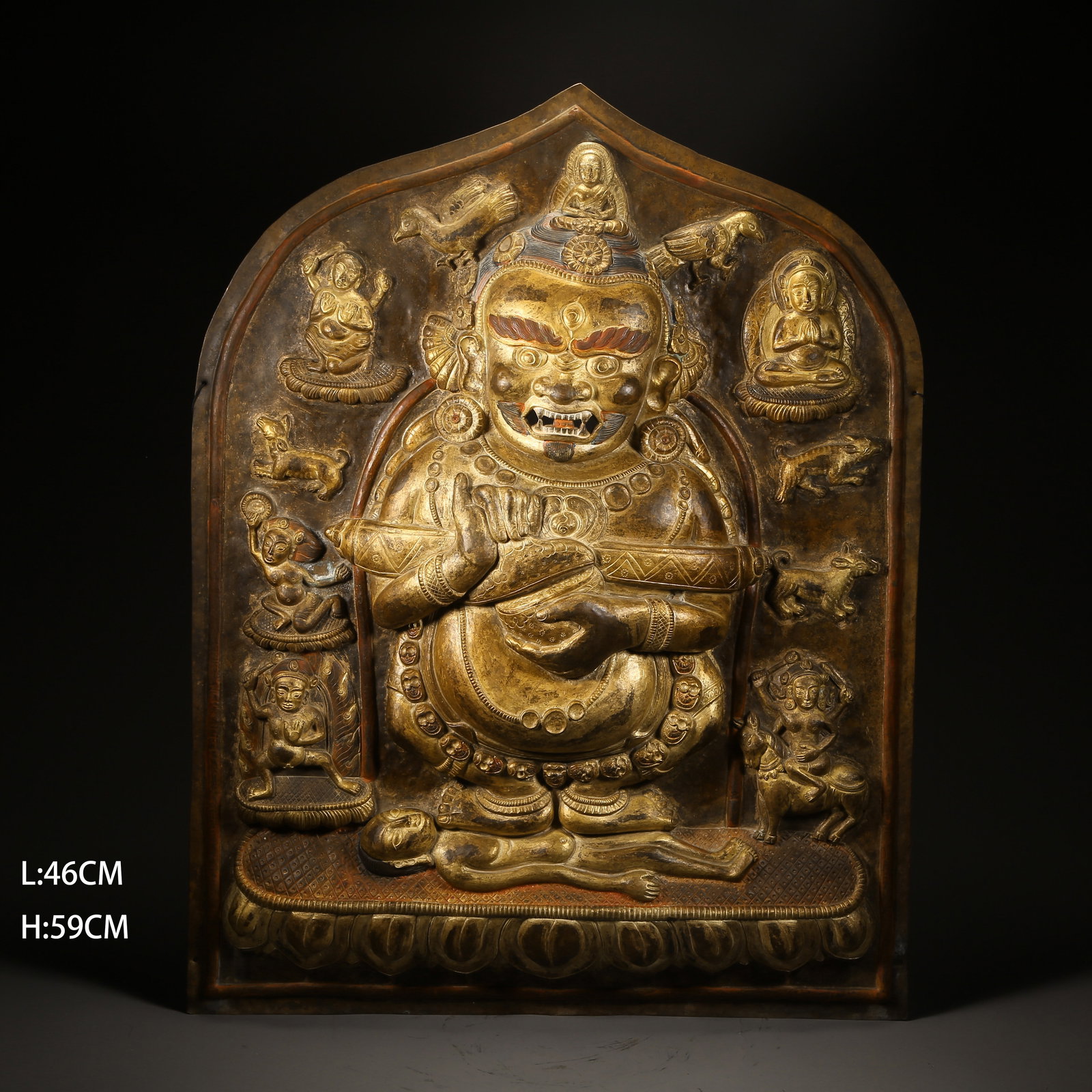 A GILDED BRONZE HAMMERED VAJRA-HOLDING DEITY PLAQUE (1 of 8)
