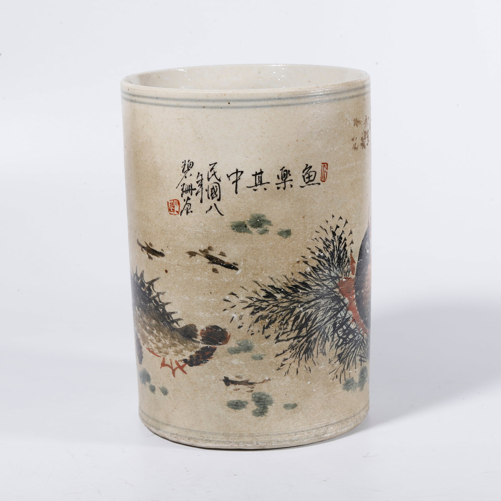 A FAMILLE-ROSE FISH-AND-ALGAE BRUSH HOLDER: Famille-rose fish-and-algae brush holder