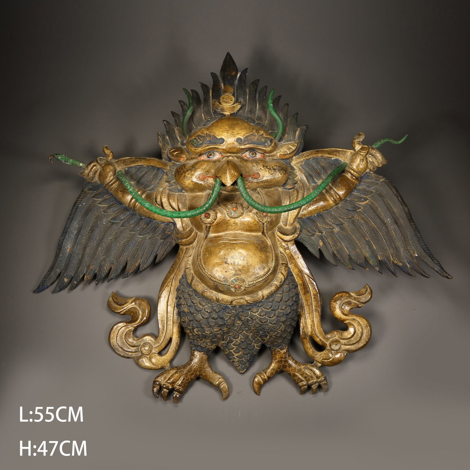 A GILDED BRONZE HAMMERED GARUDA: Gilded bronze hammered Garuda