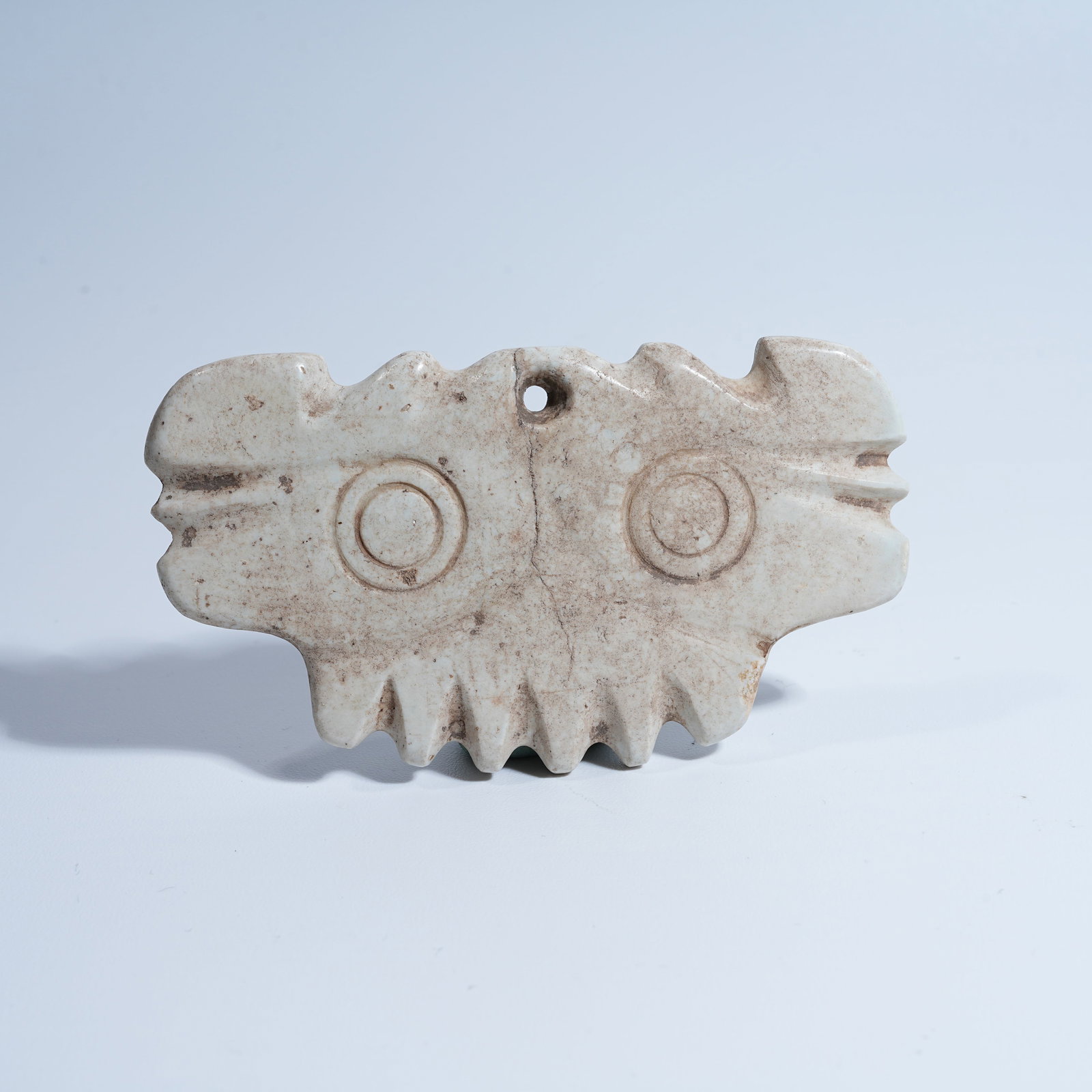 A HONGSHAN CULTURE ARCHAIC JADE CLOUD-SCROLL PENDANT: Hongshan Culture archaic jade cloud-scroll pendant