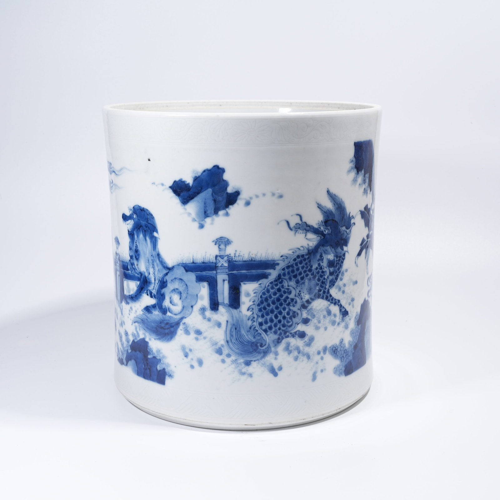 A LARGE BLUE AND WHITE BRUSH POT WITH AUSPICIOUS BEAST PATTERN: Large Blue and White Brush Pot with Auspicious Beast Pattern