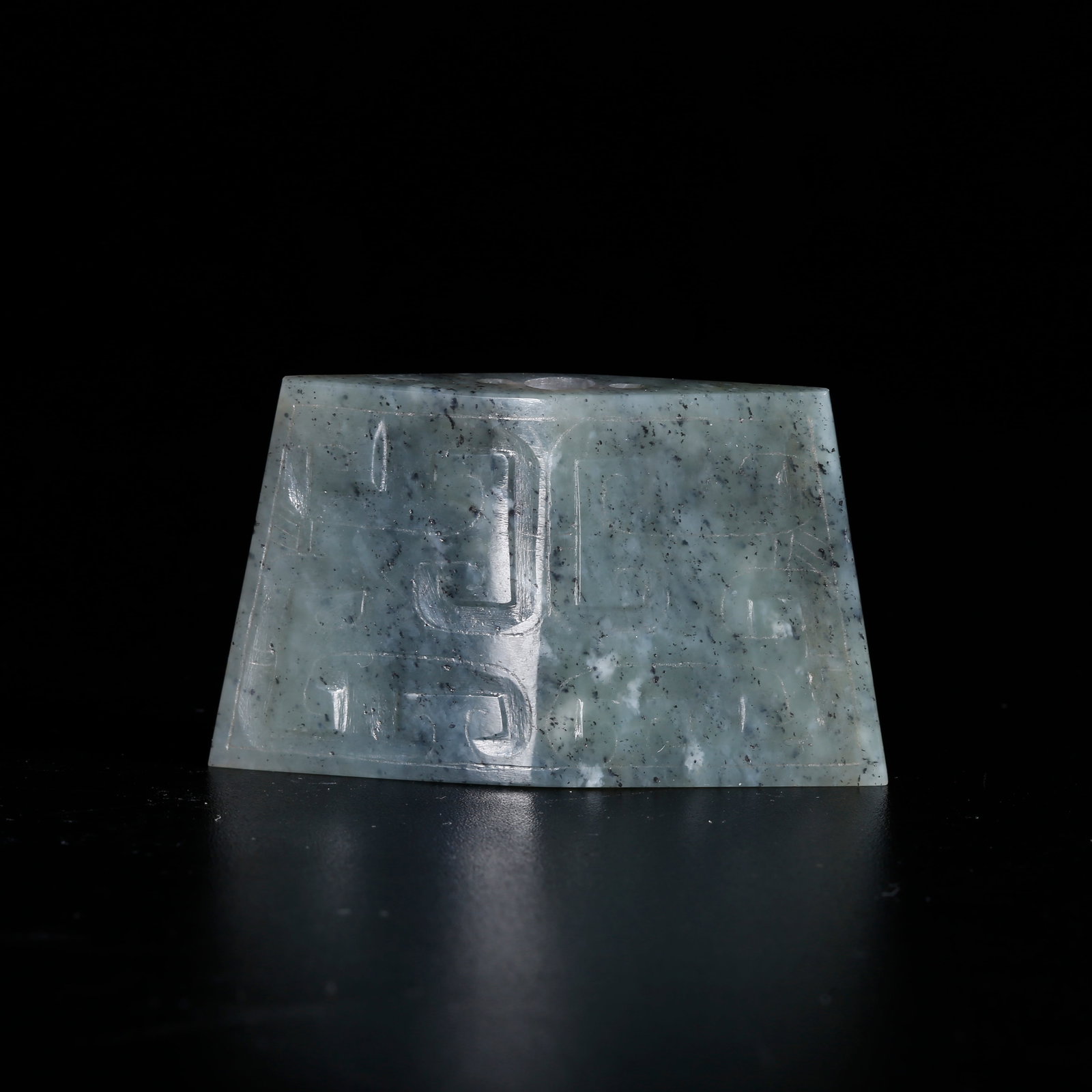 A HETIAN JADE PENDANT CARVED WITH BEAST FACE PATTERN: Hetian Jade Pendant Carved with Beast Face Pattern