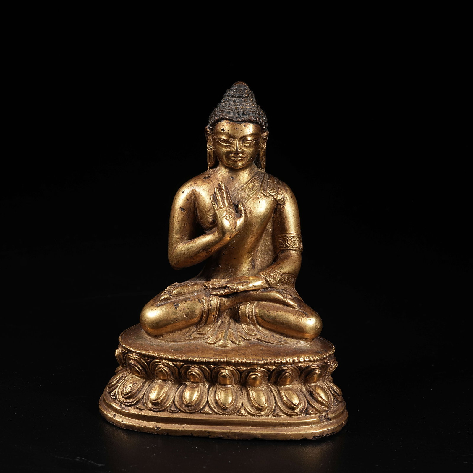A GILT COPPER STATUE OF AMOGHASIDDHI BUDDHA (1 of 9)