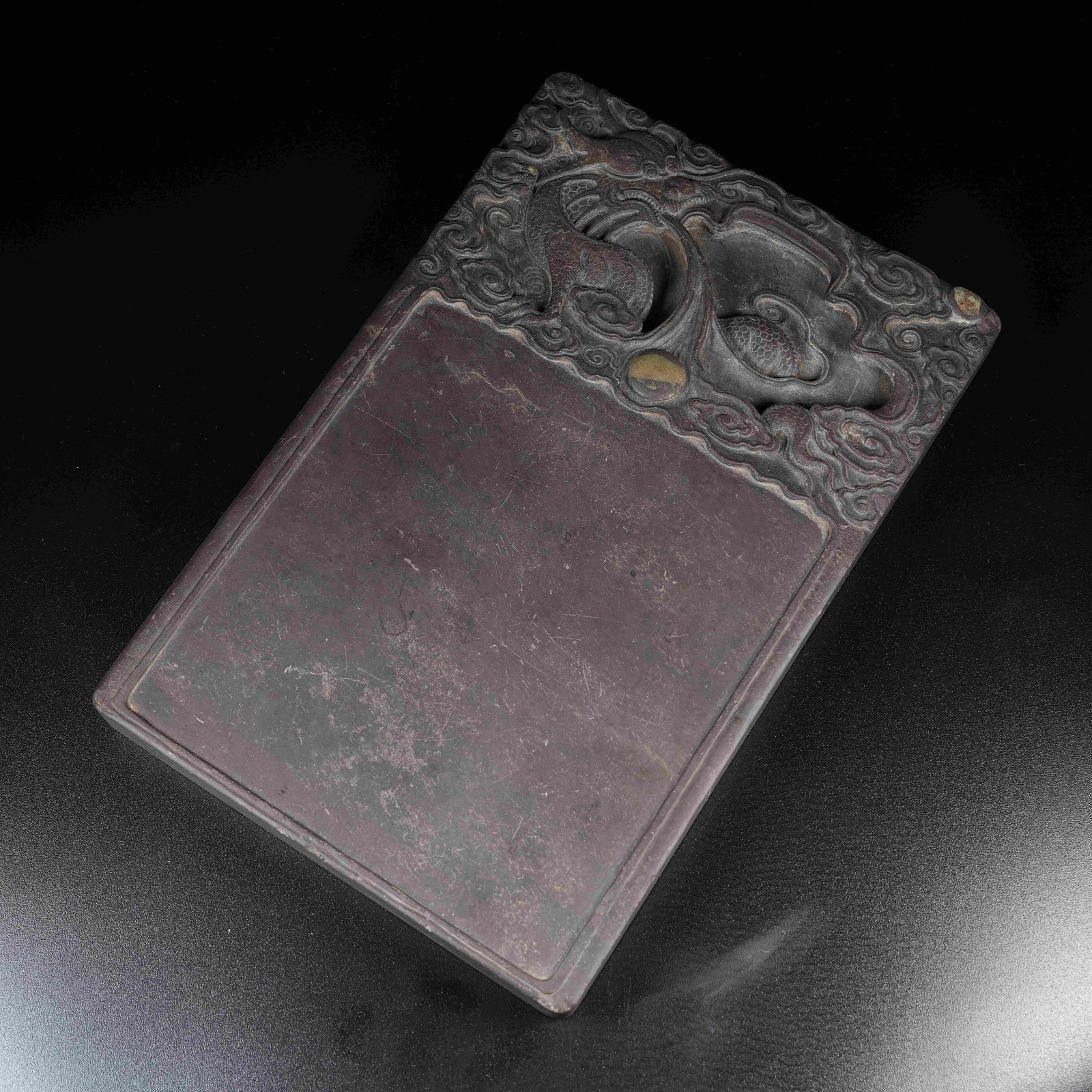 A DUAN STONE INK SLAB WITH CLOUD AND DRAGON PATTERNS: Duan Stone Ink Slab with Cloud and Dragon Patterns