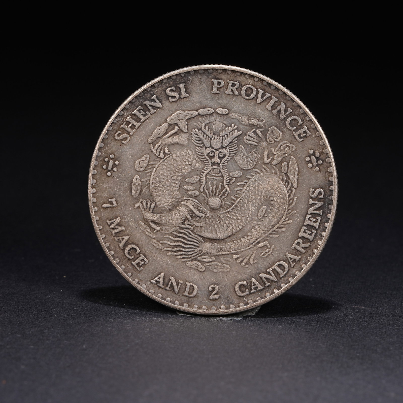 A SILVER DOLLAR COIN - 3