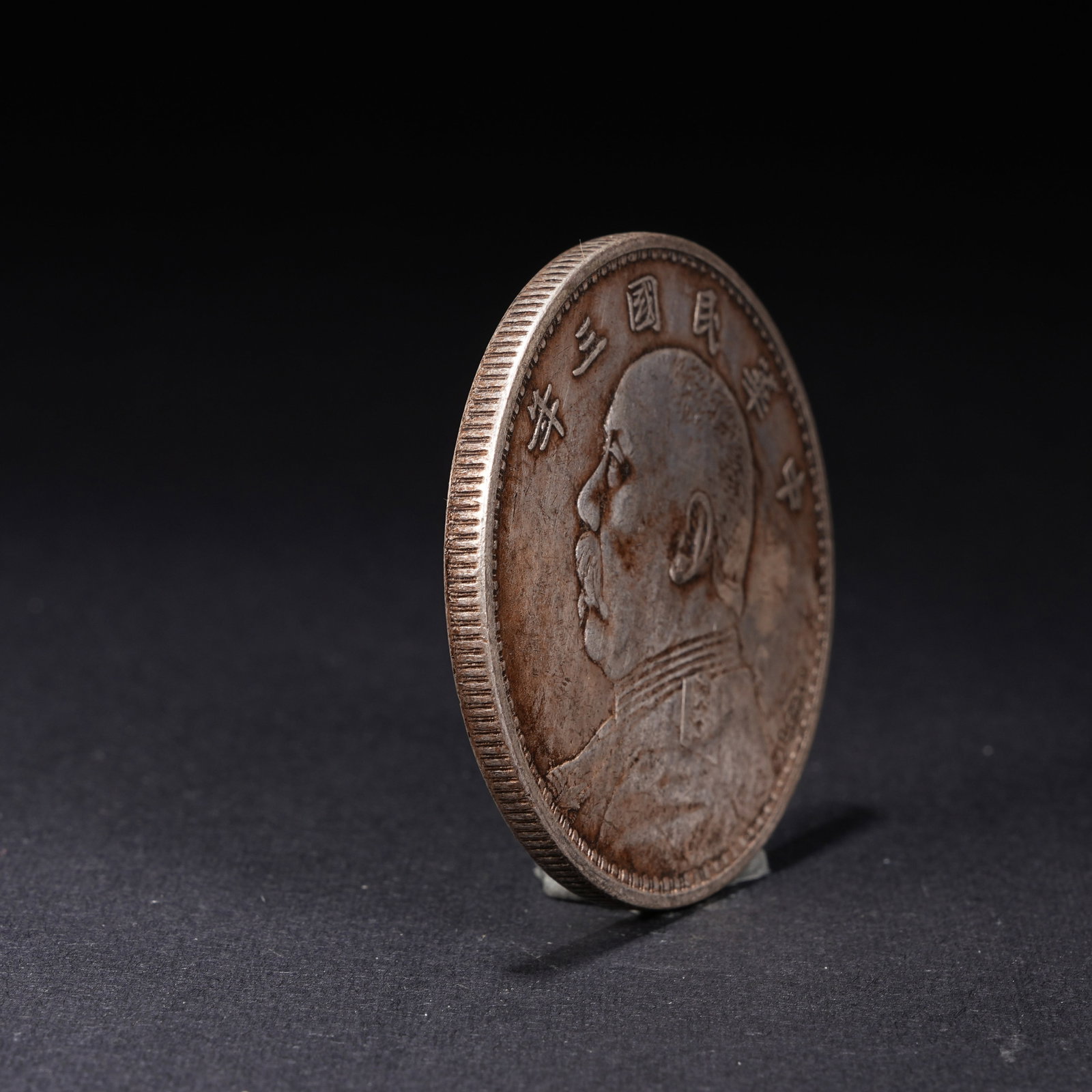 A SILVER DOLLAR COIN - 2