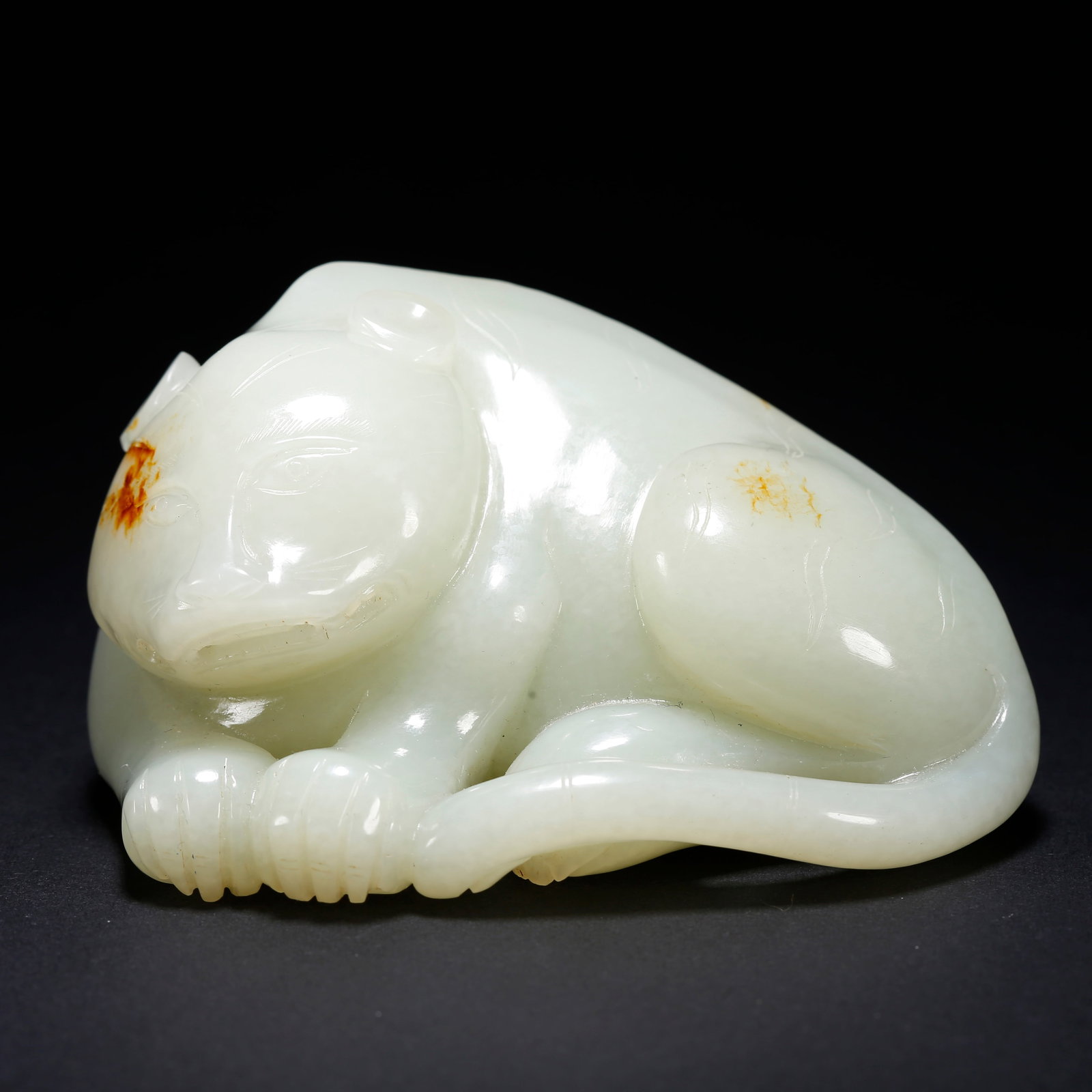 A HETIAN JADE BEAST-SHAPED FIGURINE (1 of 10)