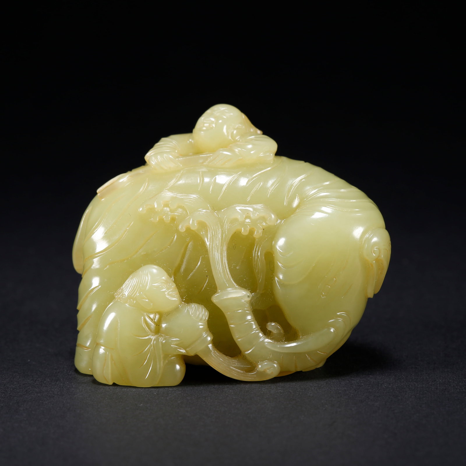 A HETIAN YELLOW JADE CHILD-SHAPED WASHER (1 of 9)