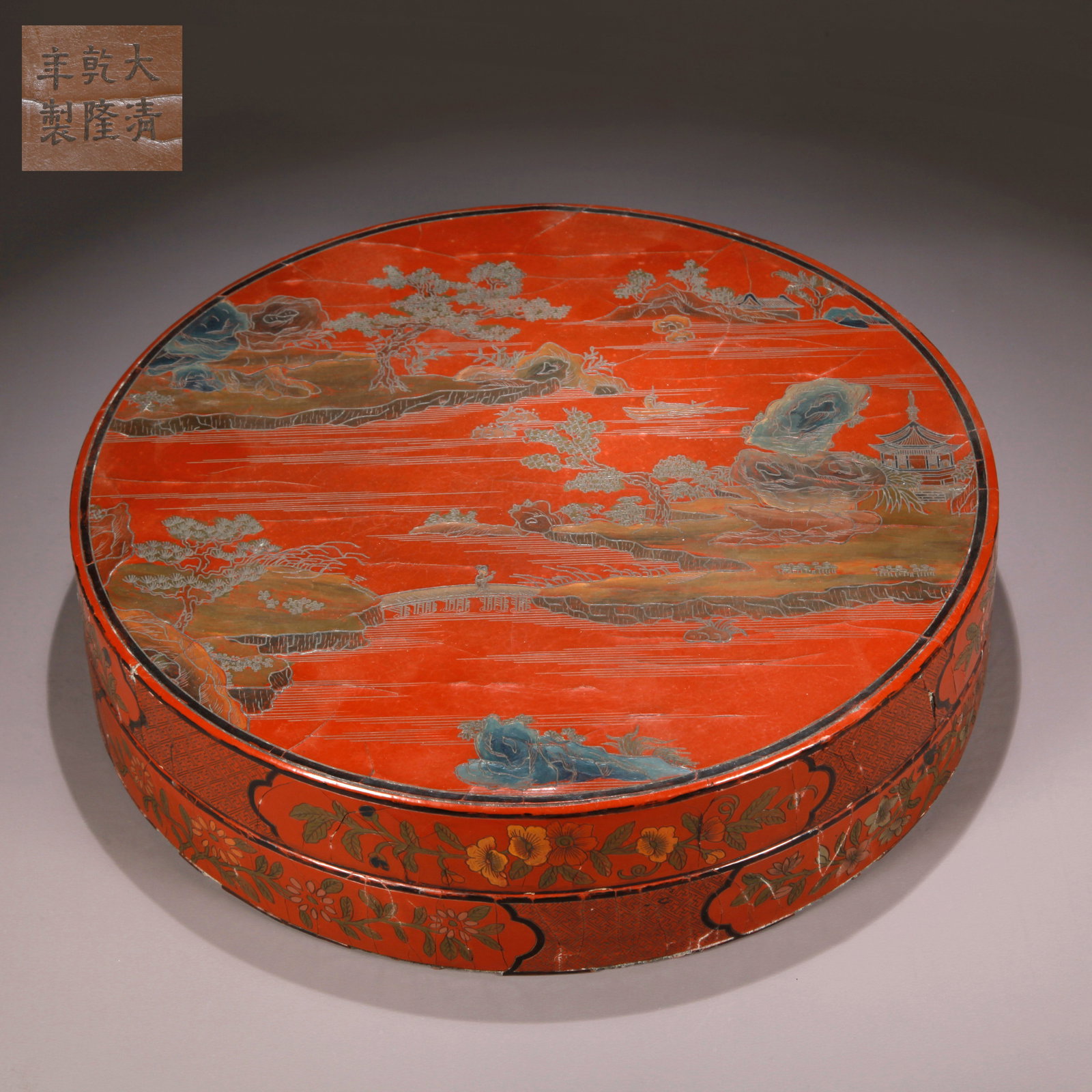 A CARVED RED LACQUER COVERED BOX WITH LANDSCAPE PATTERN (1 of 9)