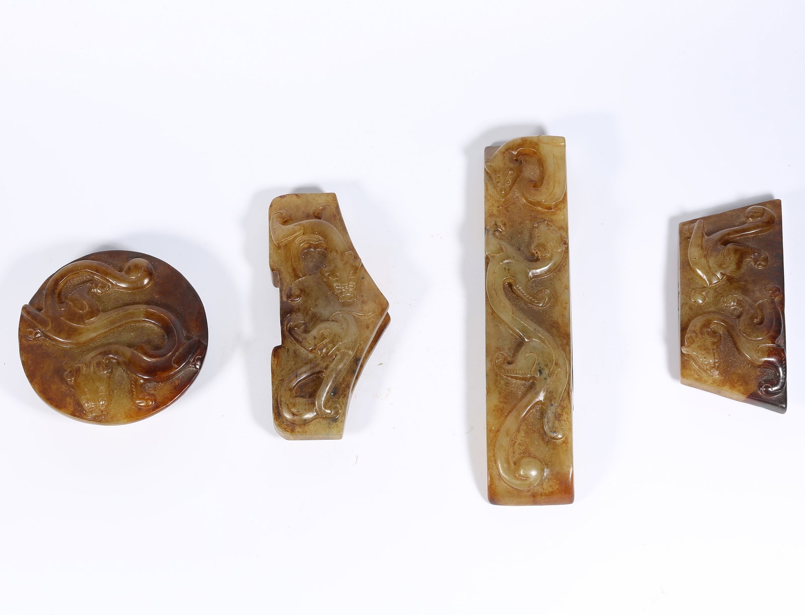 A SET OF ANCIENT JADE SWORD FITTINGS WITH CHI-DRAGON MOTIF (1 of 12)