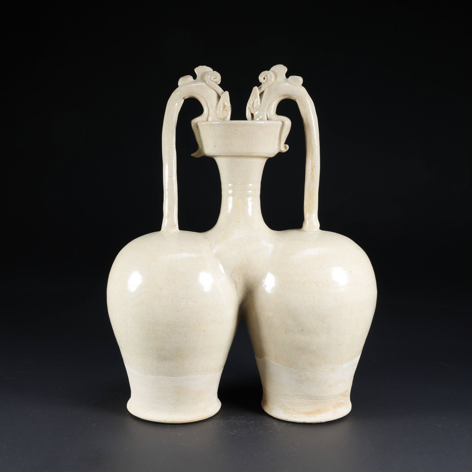 A WHITE-GLAZED DOUBLE-HANDLED PAIRED DRAGON BOTTLE (1 of 10)