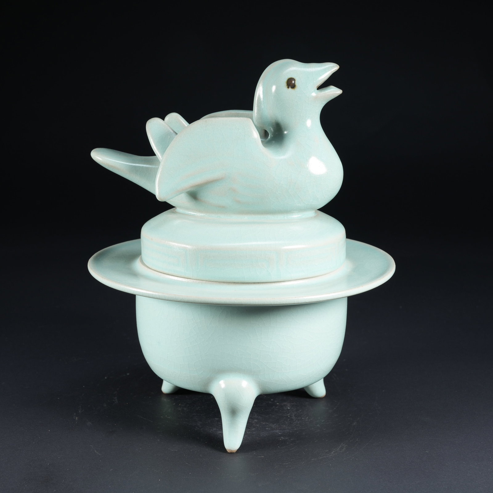 A TIANQING GLAZED TRIPOD FOLDED-RIM INCENSE BURNER WITH PHOENIX KNOB: Tianqing Glazed Tripod Folded-Rim Incense Burner with Phoenix Knob