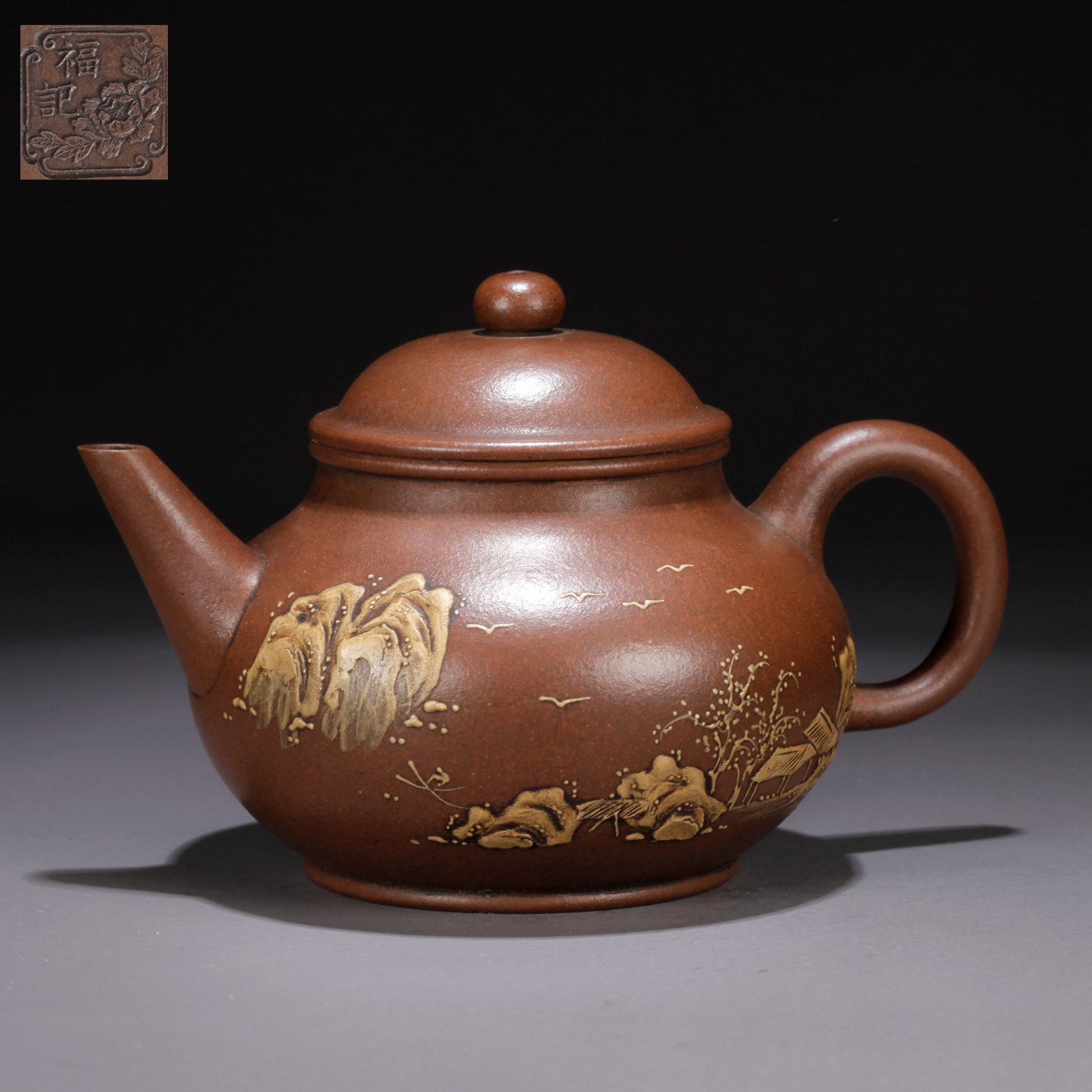 A PURPLE CLAY (ZISHA) LANDSCAPE TEAPOT: Purple Clay (Zisha) Landscape Teapot