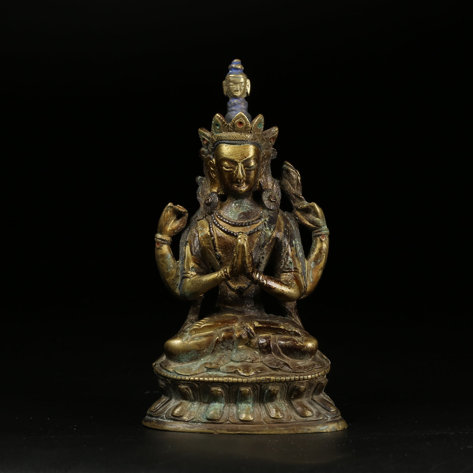 A GILT-BRONZE FOUR-ARMED AVALOKITESHVARA FIGURE: Gilt-Bronze Four-Armed Avalokiteshvara Figure