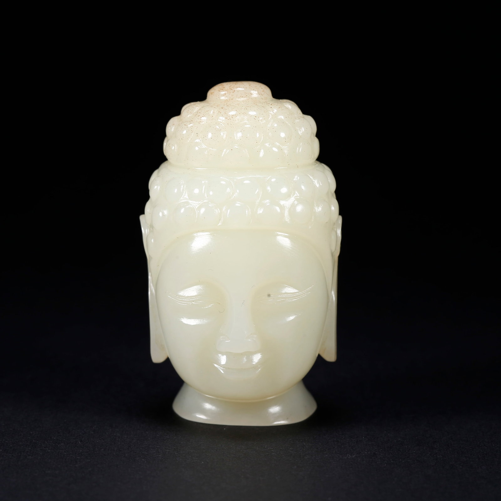 A HETIAN JADE CARVED BUDDHA HEAD (1 of 9)