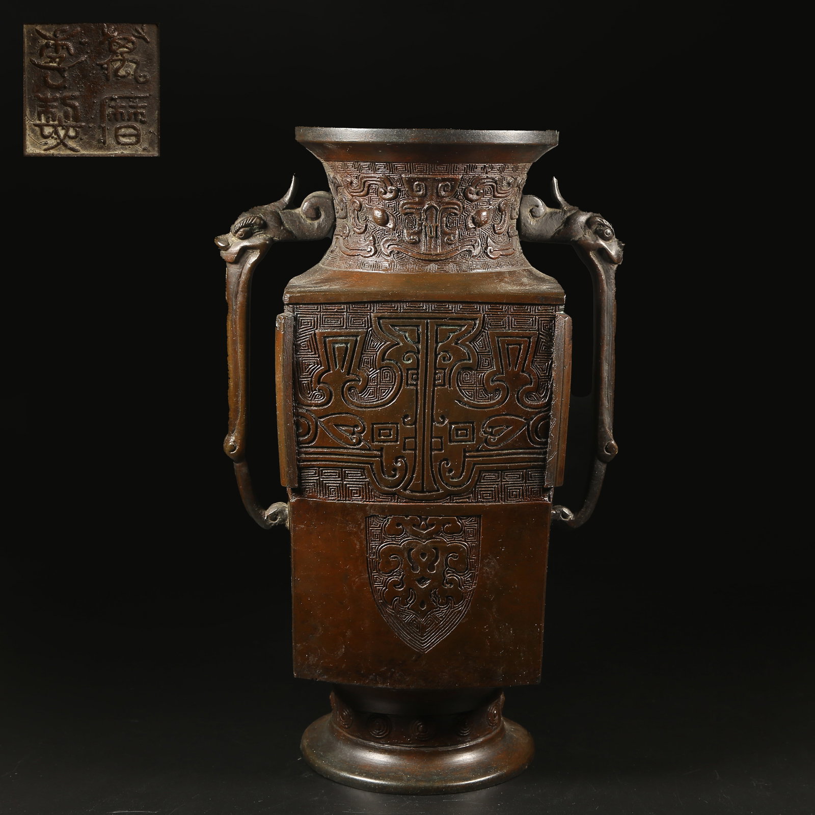 A BRONZE ZUN WITH TAOTIE MASK AND BEAST HANDLE: Bronze Zun with Taotie Mask and Beast Handle