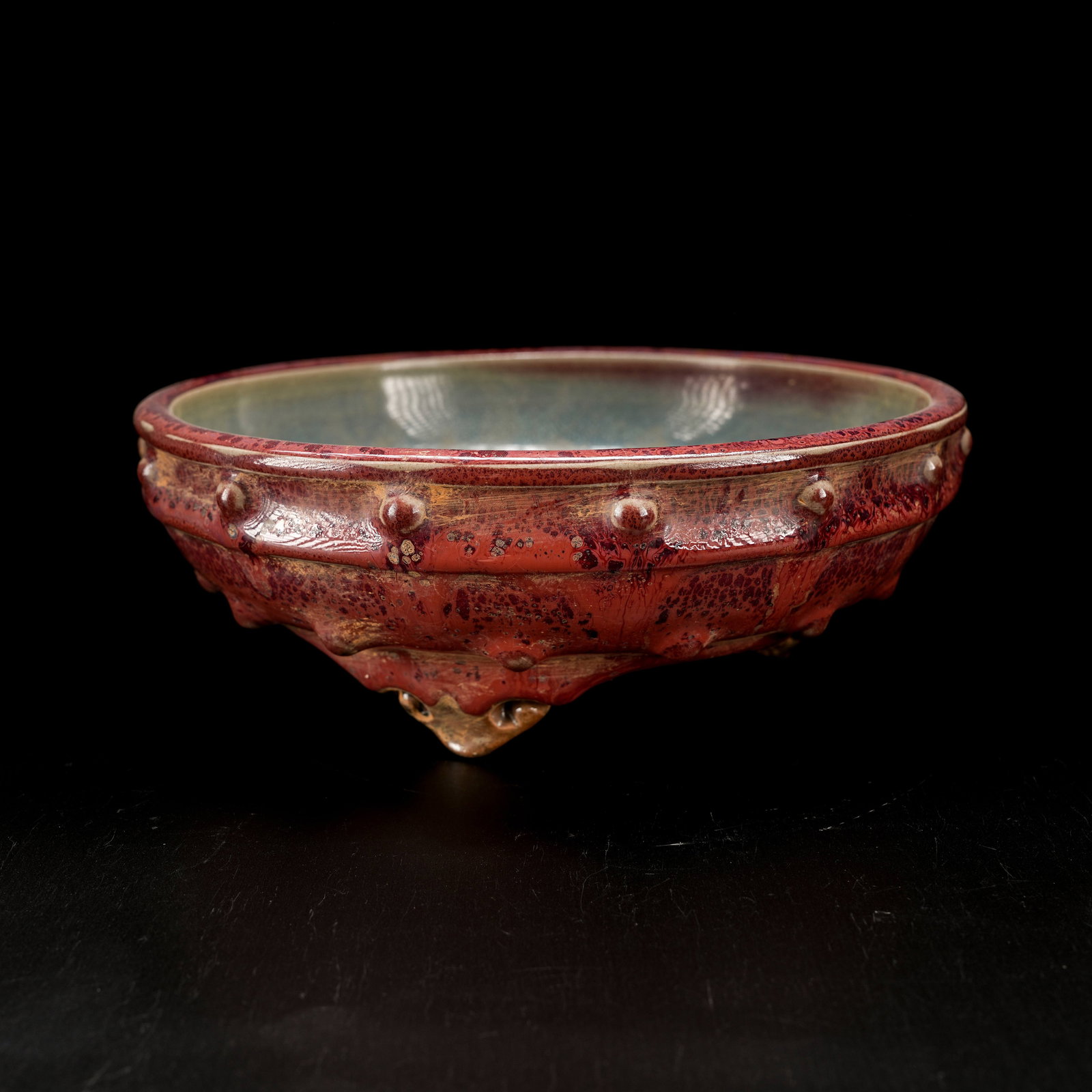 A JUN KILN THREE-LEGGED INCENSE BURNER WITH BOSS PATTERN: Jun Kiln Three-Legged Incense Burner with Boss Pattern