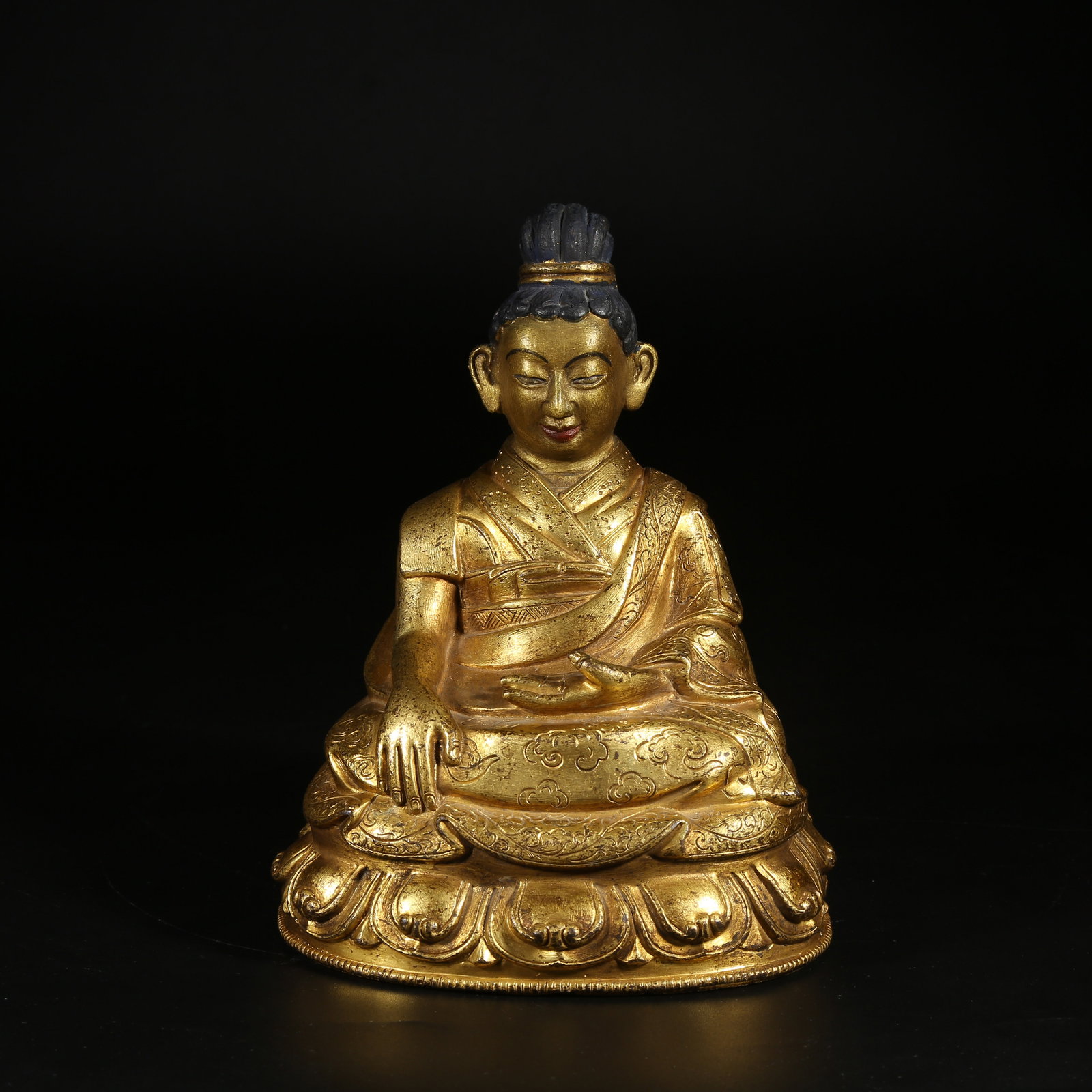 A GILT-BRONZE STATUE OF BHAISAJYAGURU (MEDICINE BUDDHA): Gilt-Bronze Statue of Bhaisajyaguru (Medicine Buddha)