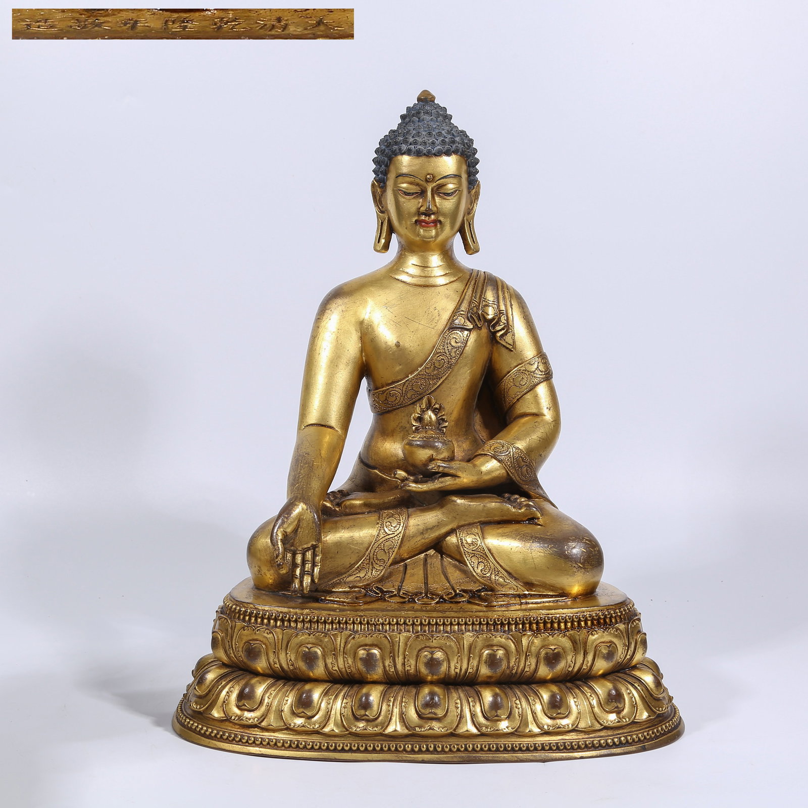A GILT BRONZE MEDICINE BUDDHA STATUE (1 of 8)