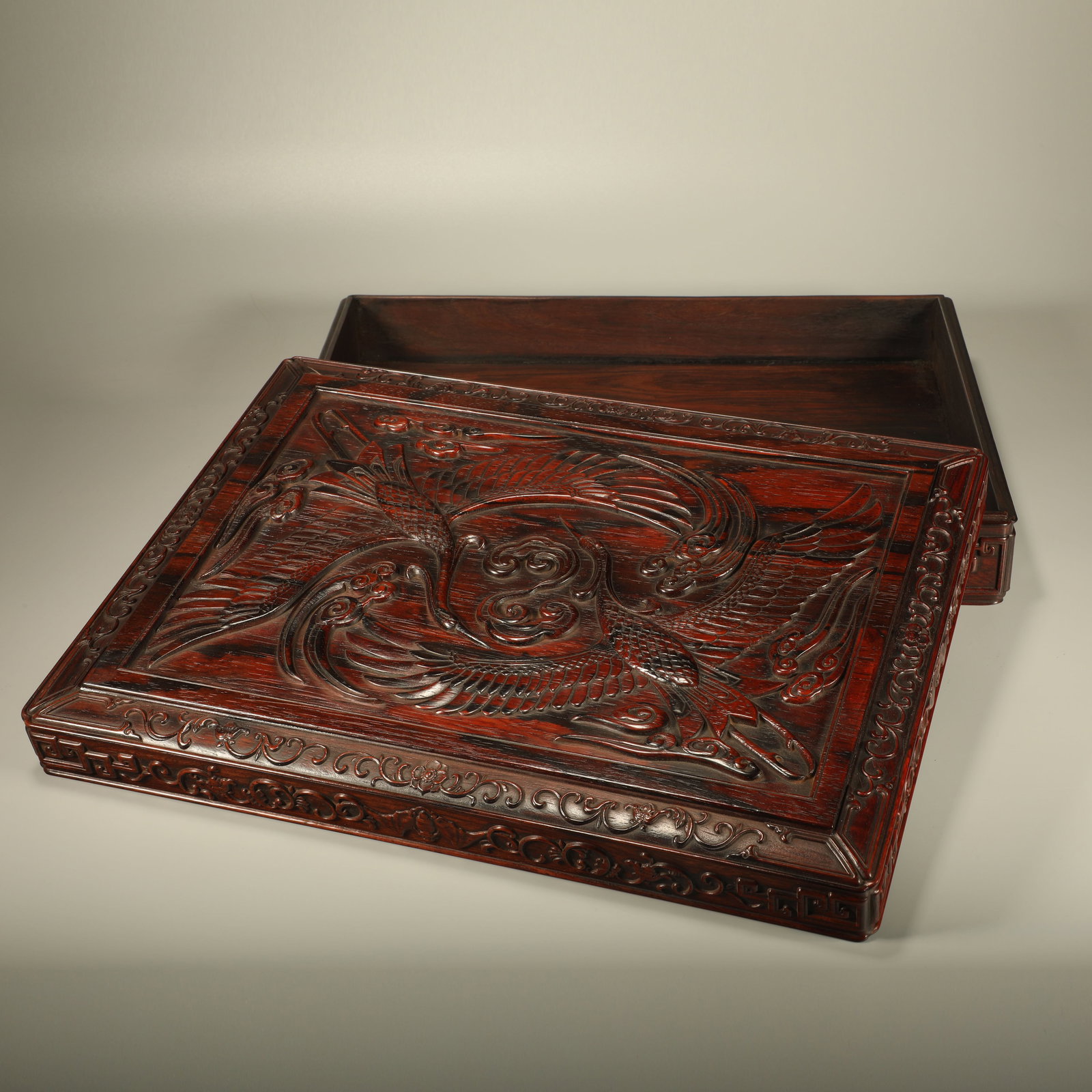 A HUANGHUALI BOX CARVED WITH CLOUD AND CRANE PATTERN: Huanghuali Box Carved with Cloud and Crane Pattern