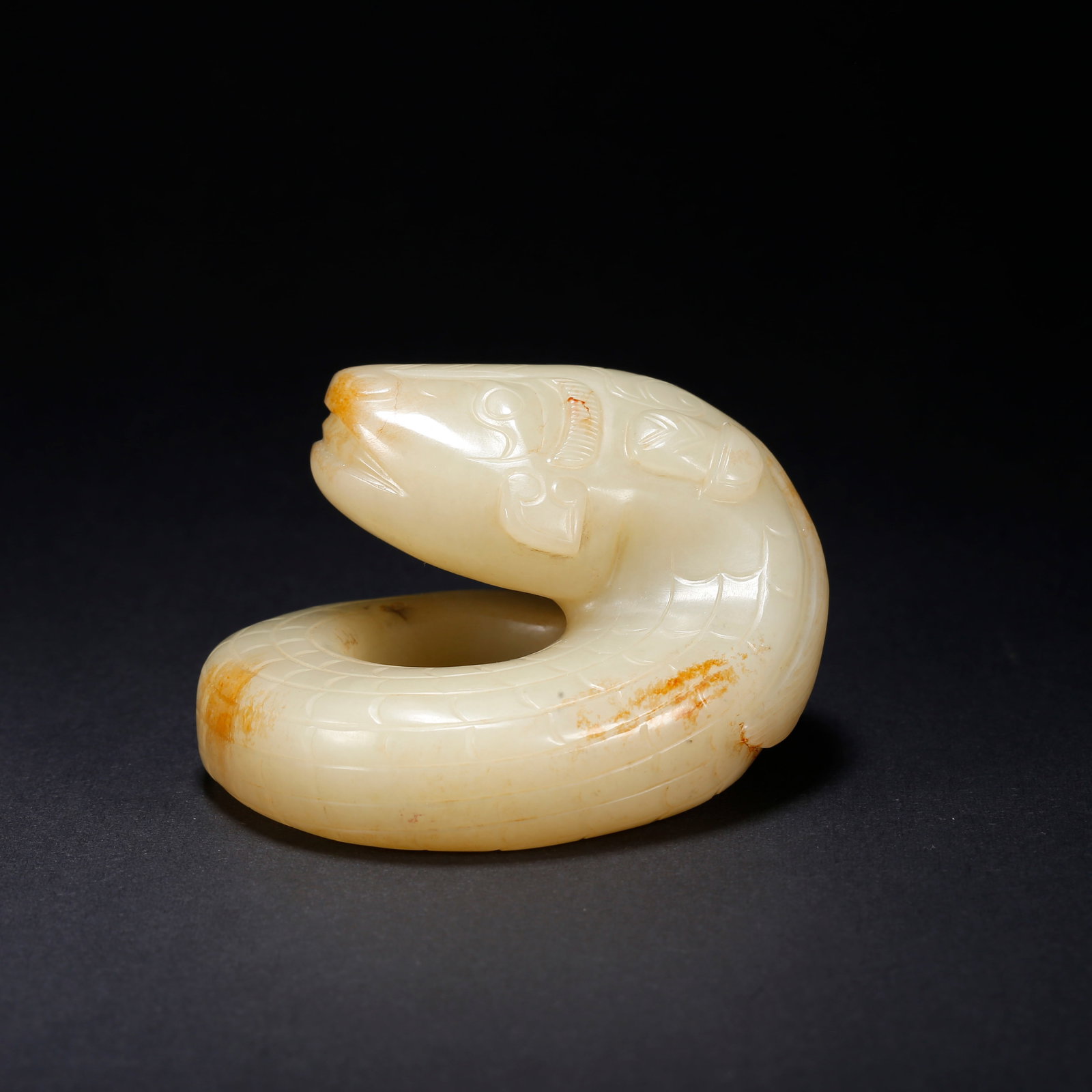 A HETIAN JADE BEAST-SHAPED FIGURINE: Hetian Jade Beast-Shaped Figurine