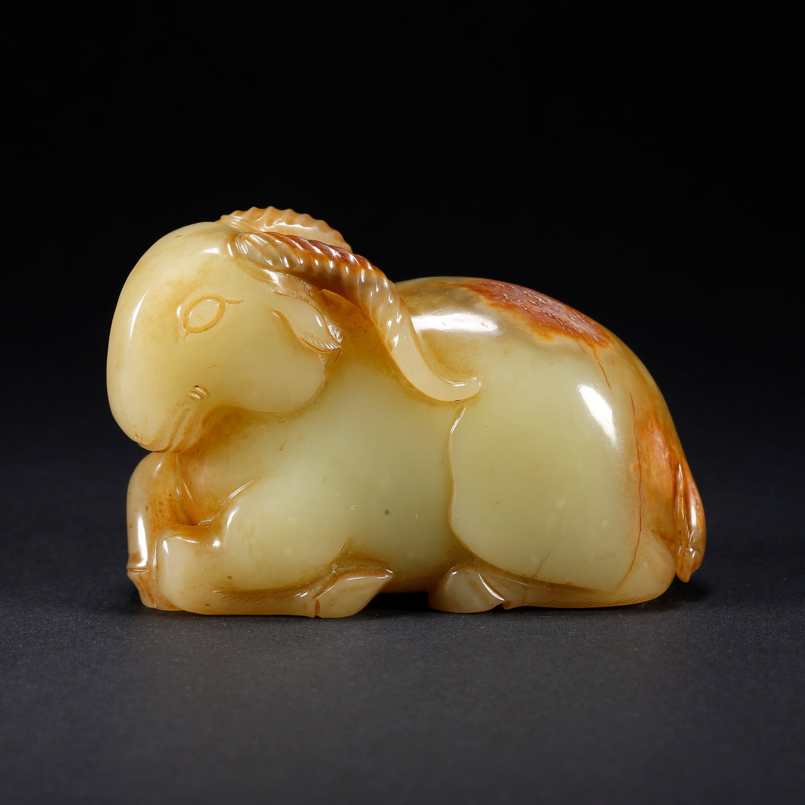 A HETIAN YELLOW JADE RAM-SHAPED HANDLE (1 of 9)