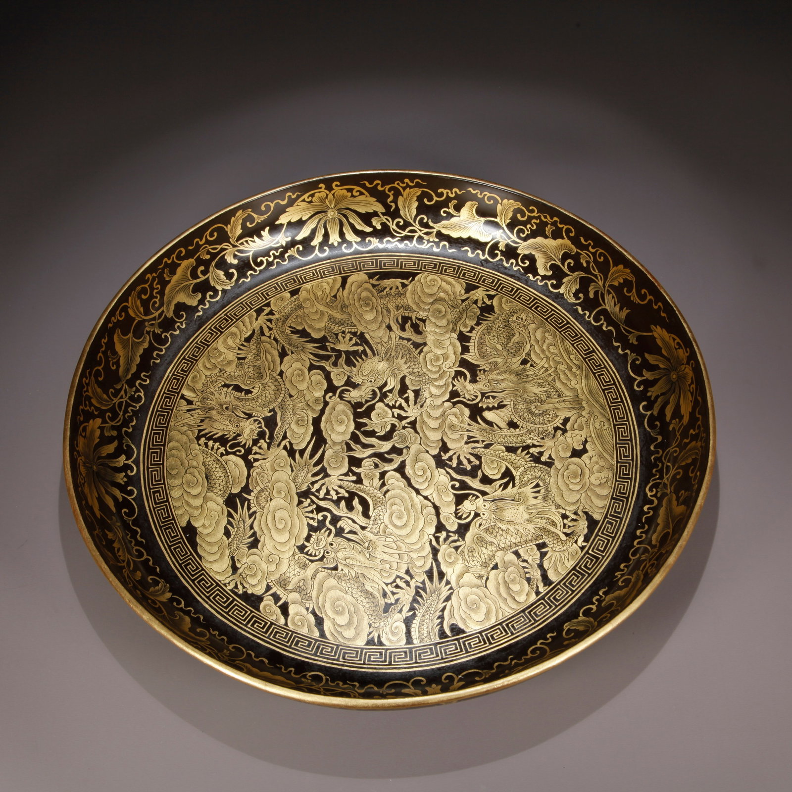 A LACQUER WITH GILDED FIVE-DRAGON PATTERN PLATE: Lacquer with Gilded Five-Dragon Pattern Plate