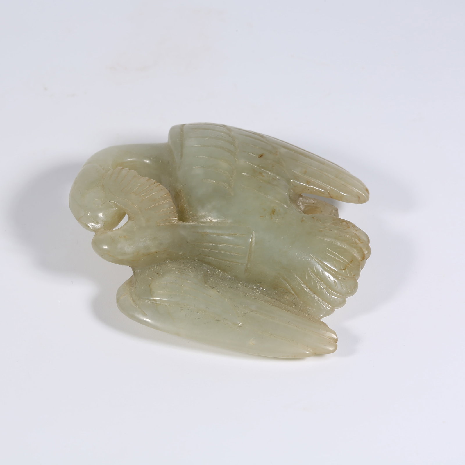 A HETIAN JADE PENDANT OF EASTERN SEA AZURE MAGPIE PECKING AT WILD GOOSE: Hetian Jade Pendant of Eastern Sea Azure Magpie Pecking at Wild Goose